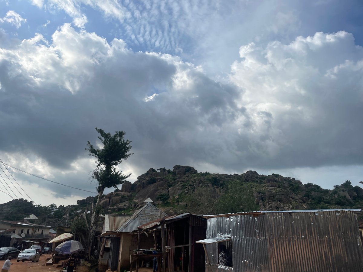 Quiet afternoon in a dusty, rocky hillside settlement