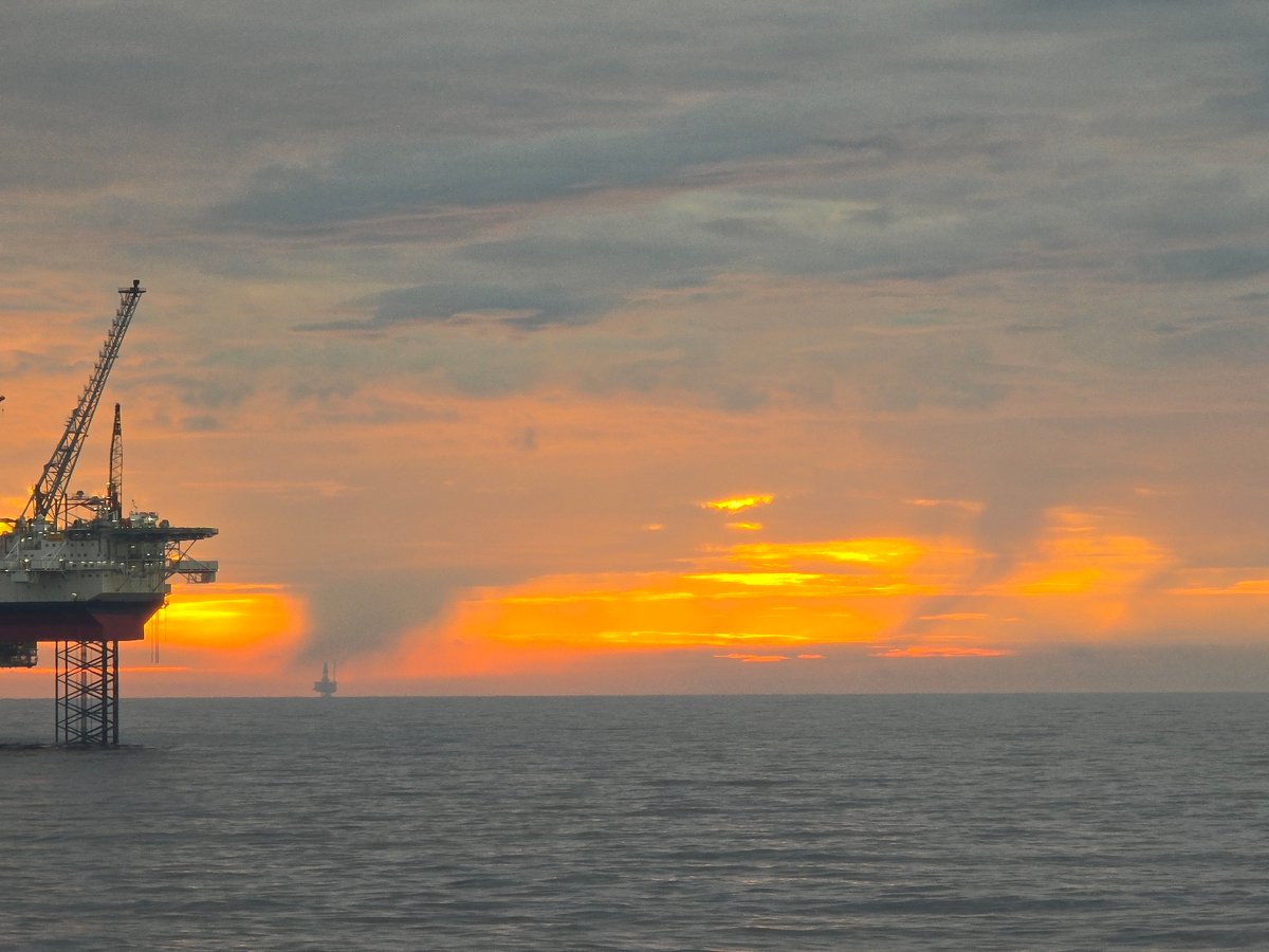 Sunset observed over North Sea oil rigs