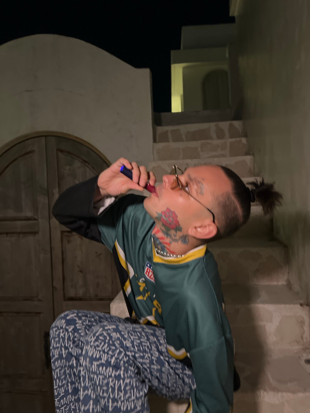 Late-night freestyle session: breakdancing and poolside antics in a green jersey