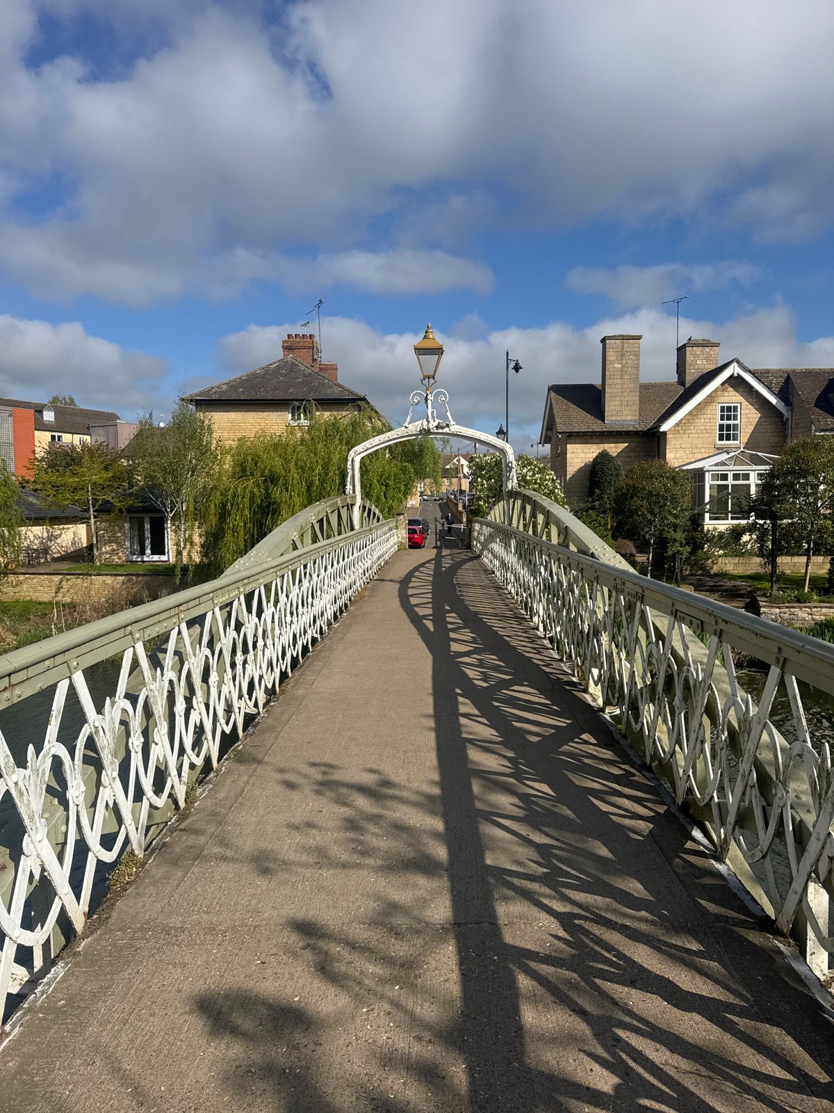 Sunlit pedestrian bridge photographed in South Kesteven, UK