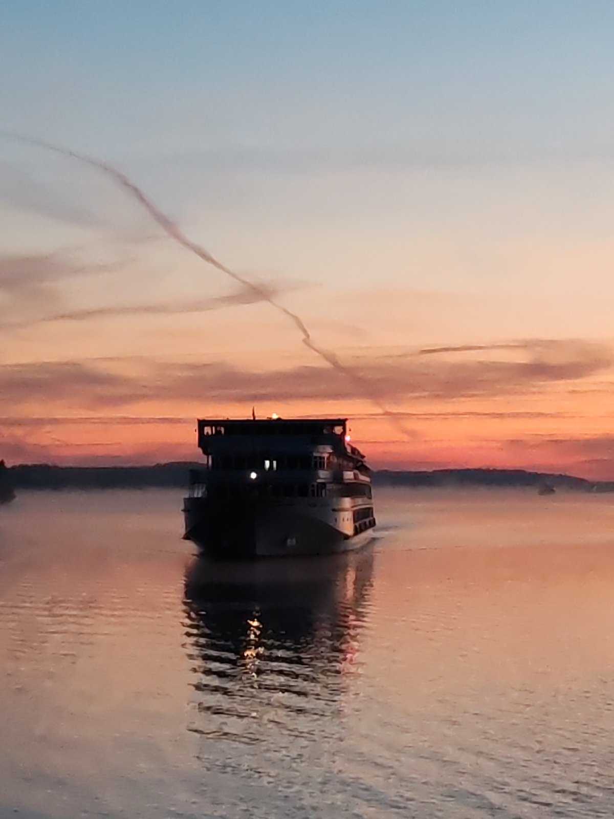 Vessel navigates Russian waters during twilight in Eremeitsevo