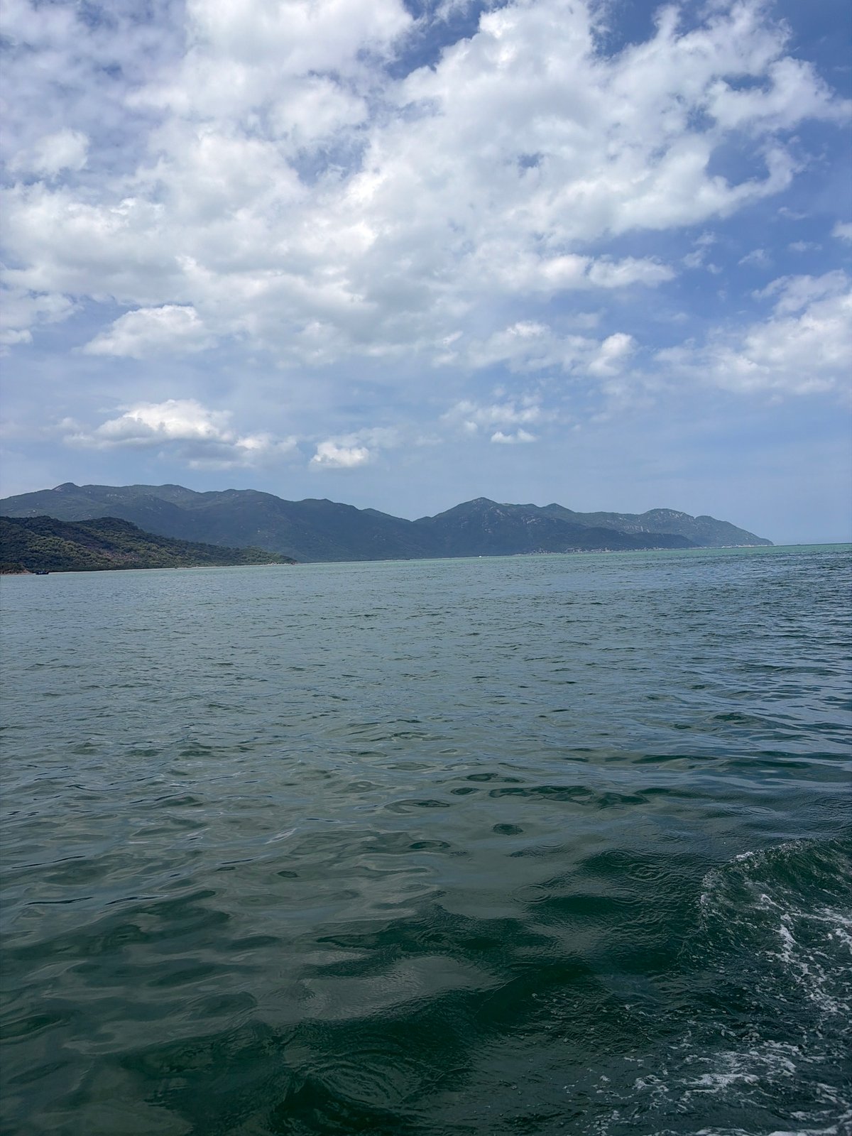 Coastal boat journey and temple grounds in Ninh Ích, Vietnam