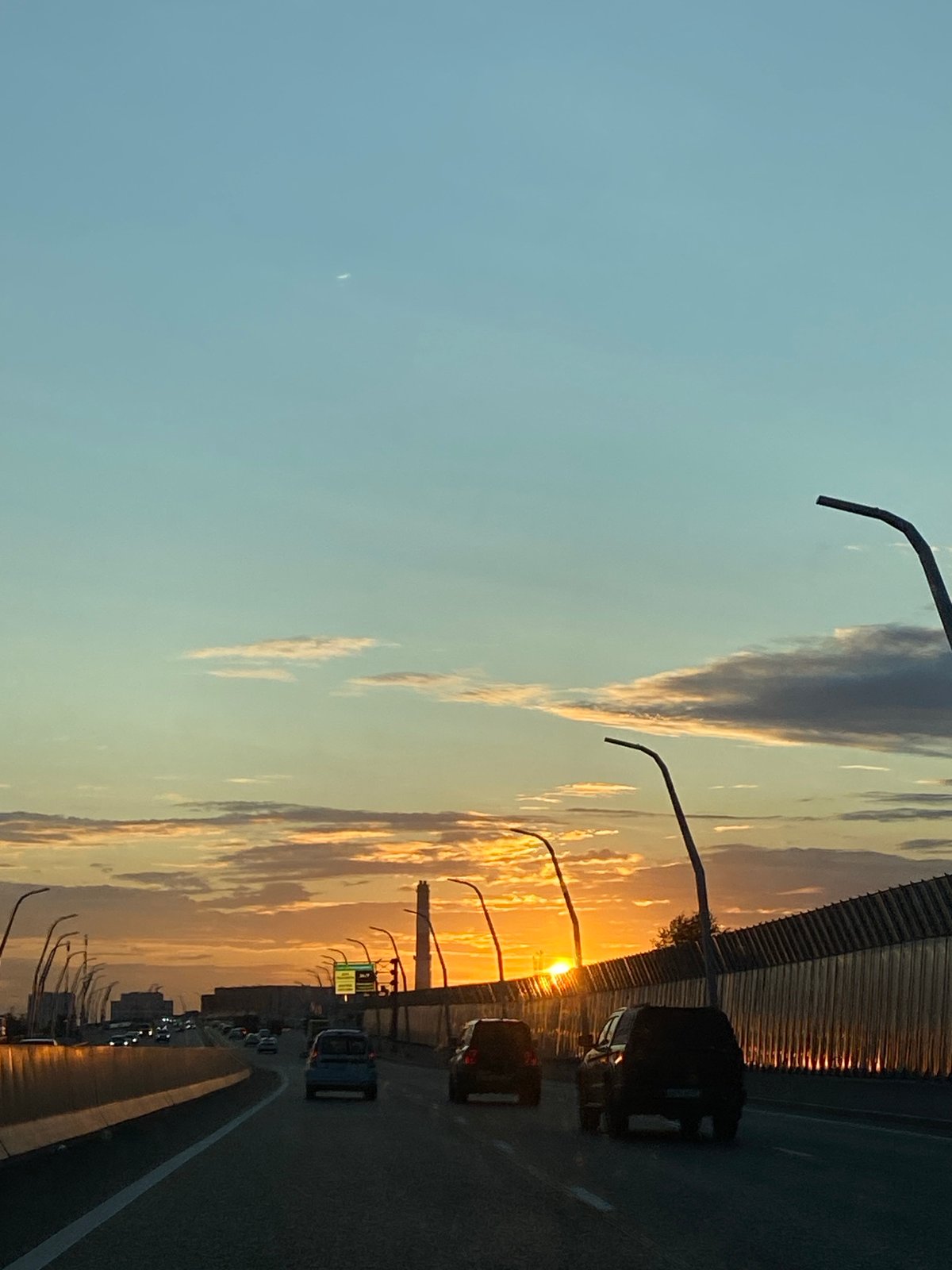 Crescent moon rises over Lyubertsy highway at dusk