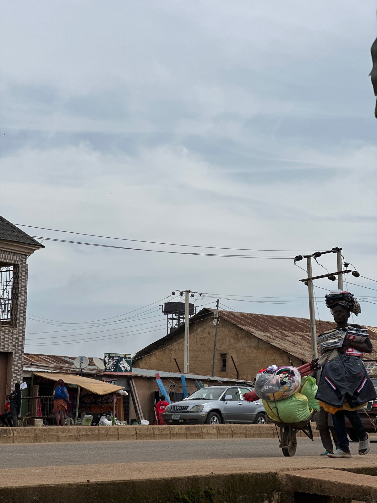 A busy morning on the streets near Victory Plaza, Bukuru