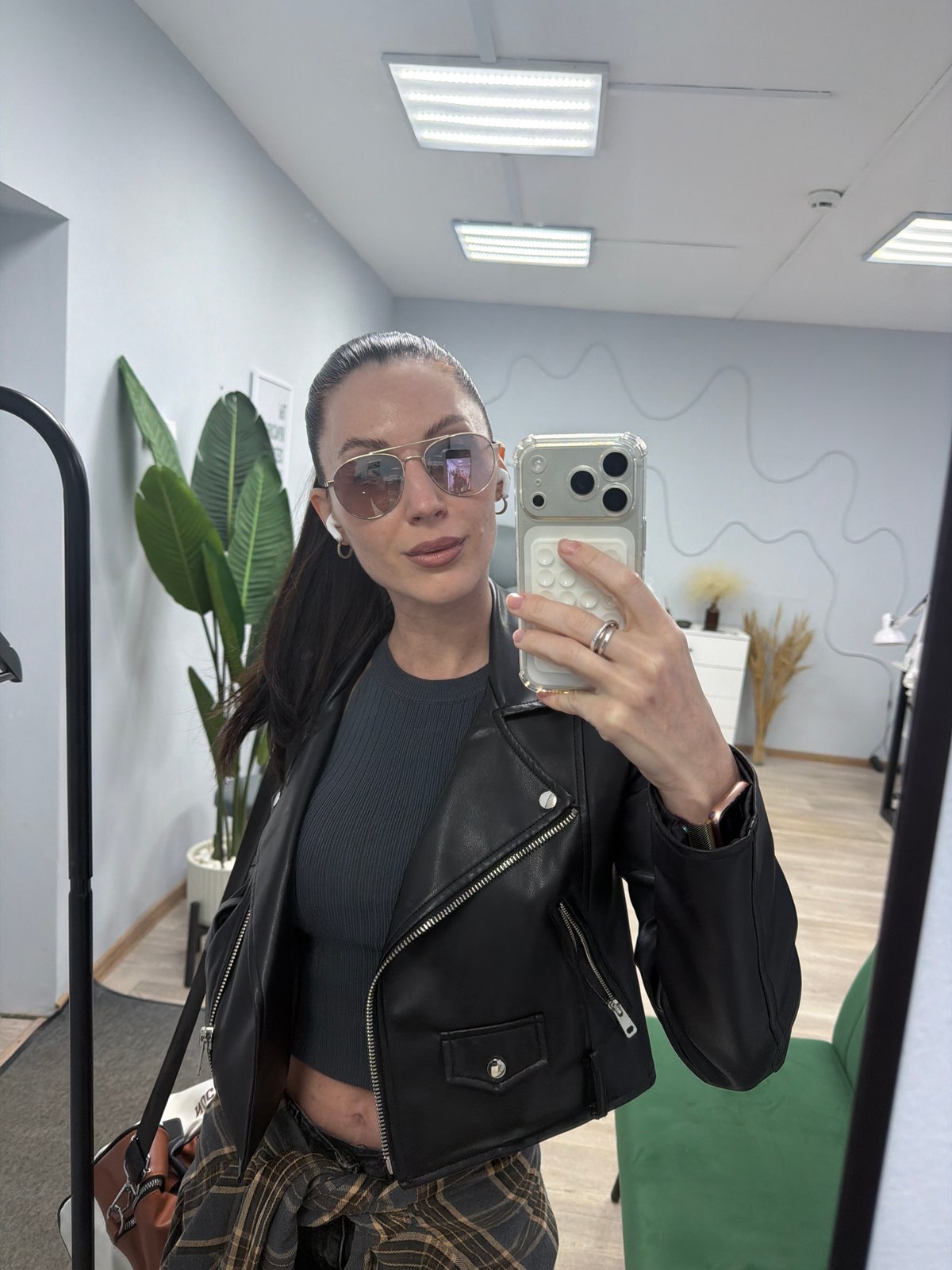 Woman takes selfies indoors in Perm, Russia