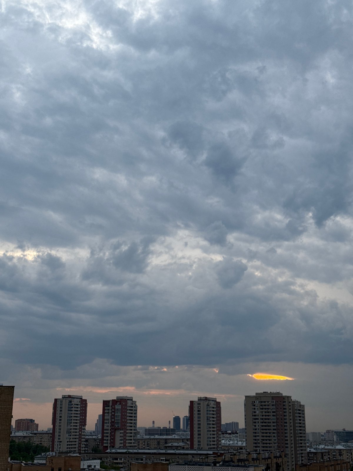 Dramatic sunset breaks through storm clouds over Moscow skyline