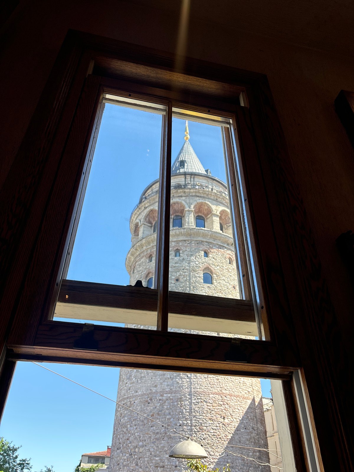 Crowds gather at Istanbul's Galata Tower on sunny Saturday