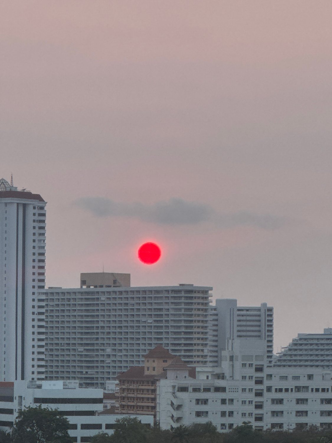 Striking red sun phenomenon observed over Pattaya City Thailand