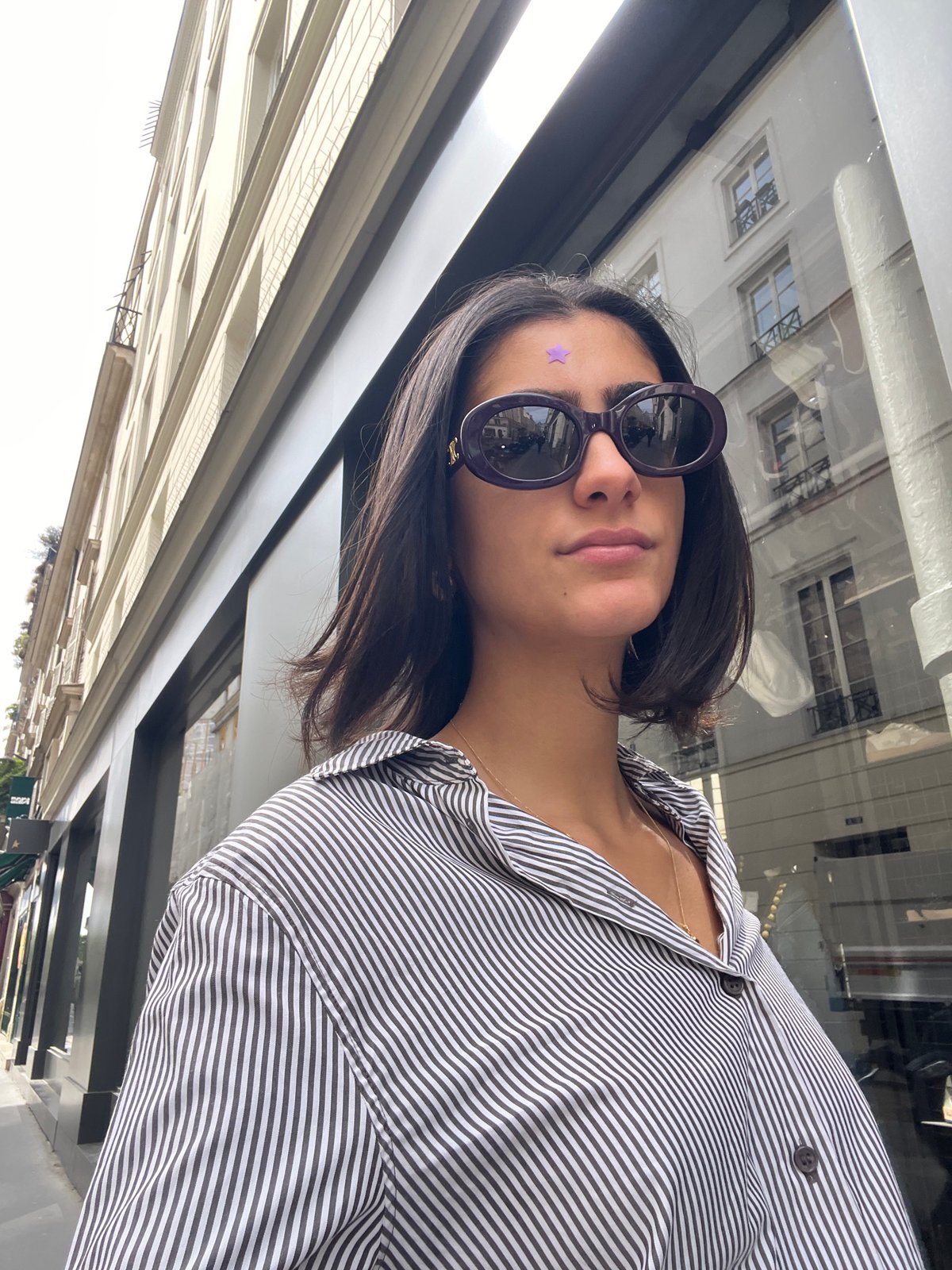 Woman with purple star spotted in Paris workspace setting