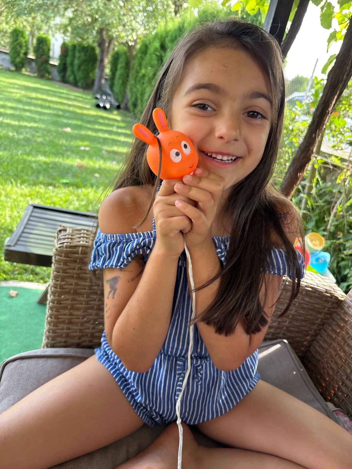Backyard afternoon in Oreshak with a rabbit toy