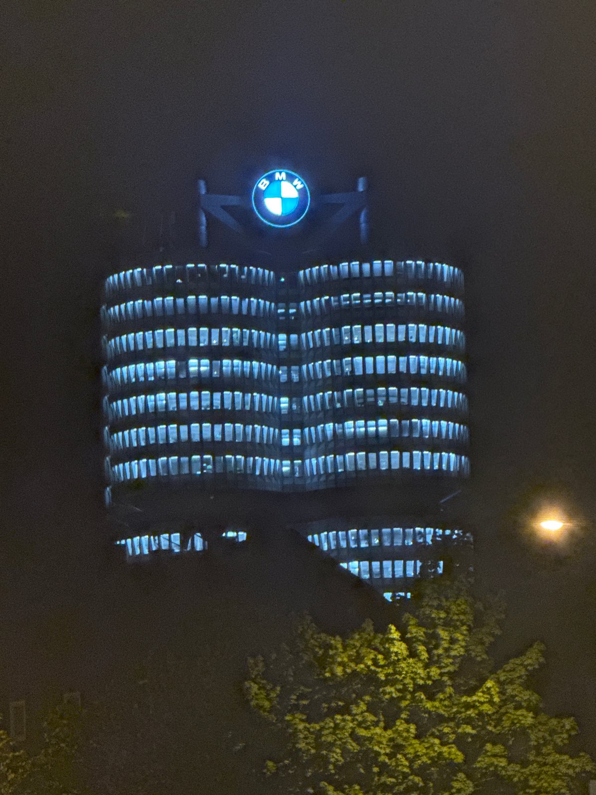 BMW Munich headquarters glows blue at night