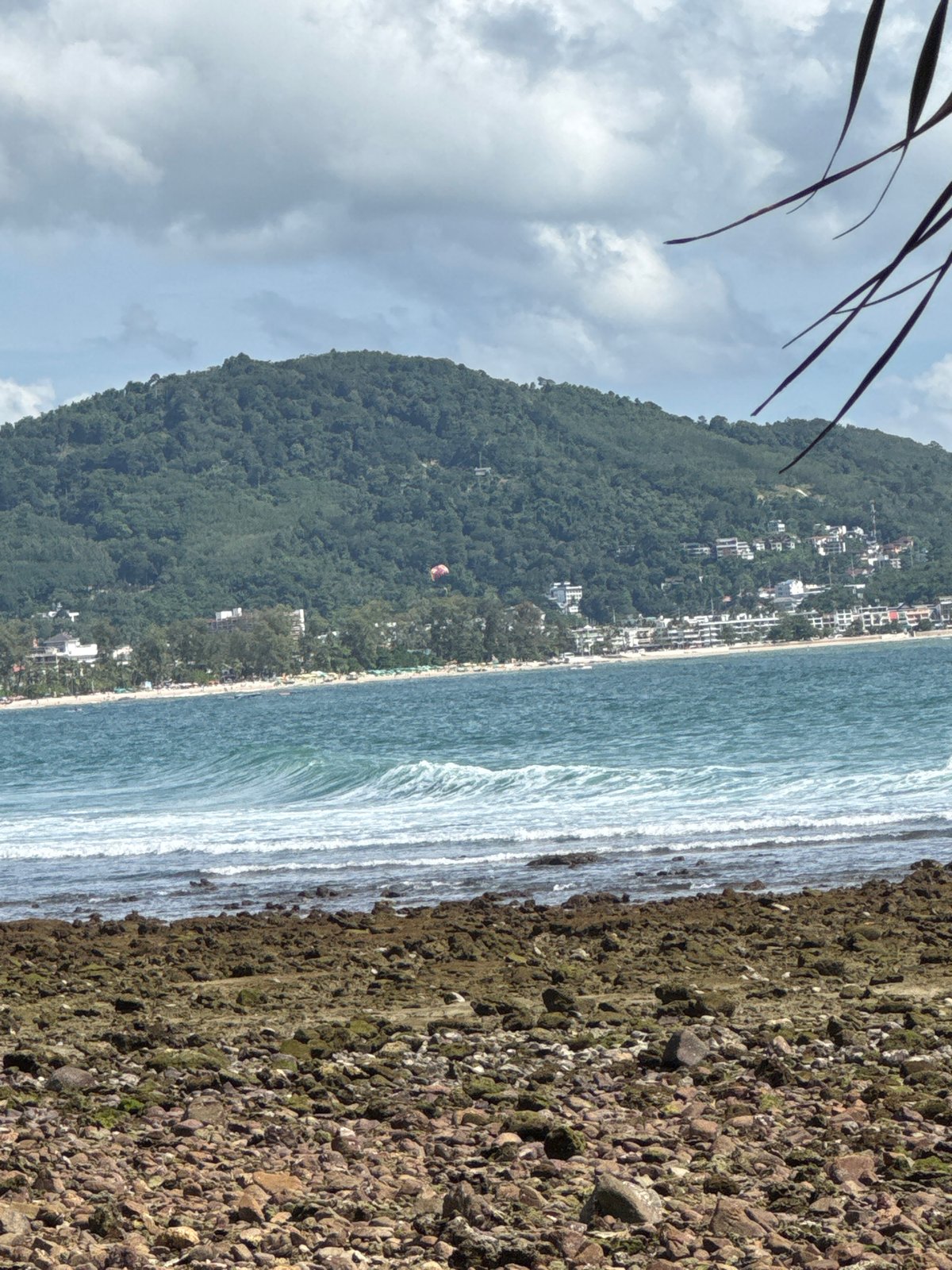 Morning at Patong's rocky coastline and beach