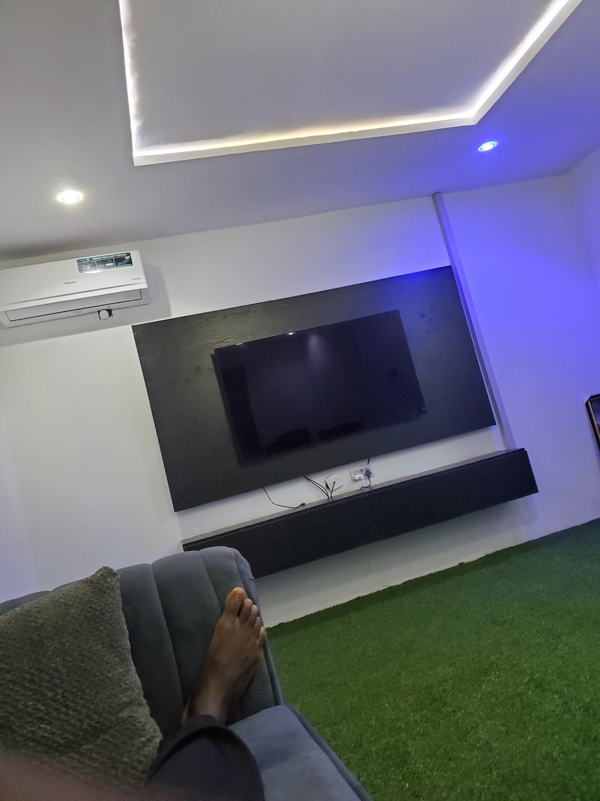 Modern living room with LED-accented entertainment setup documented