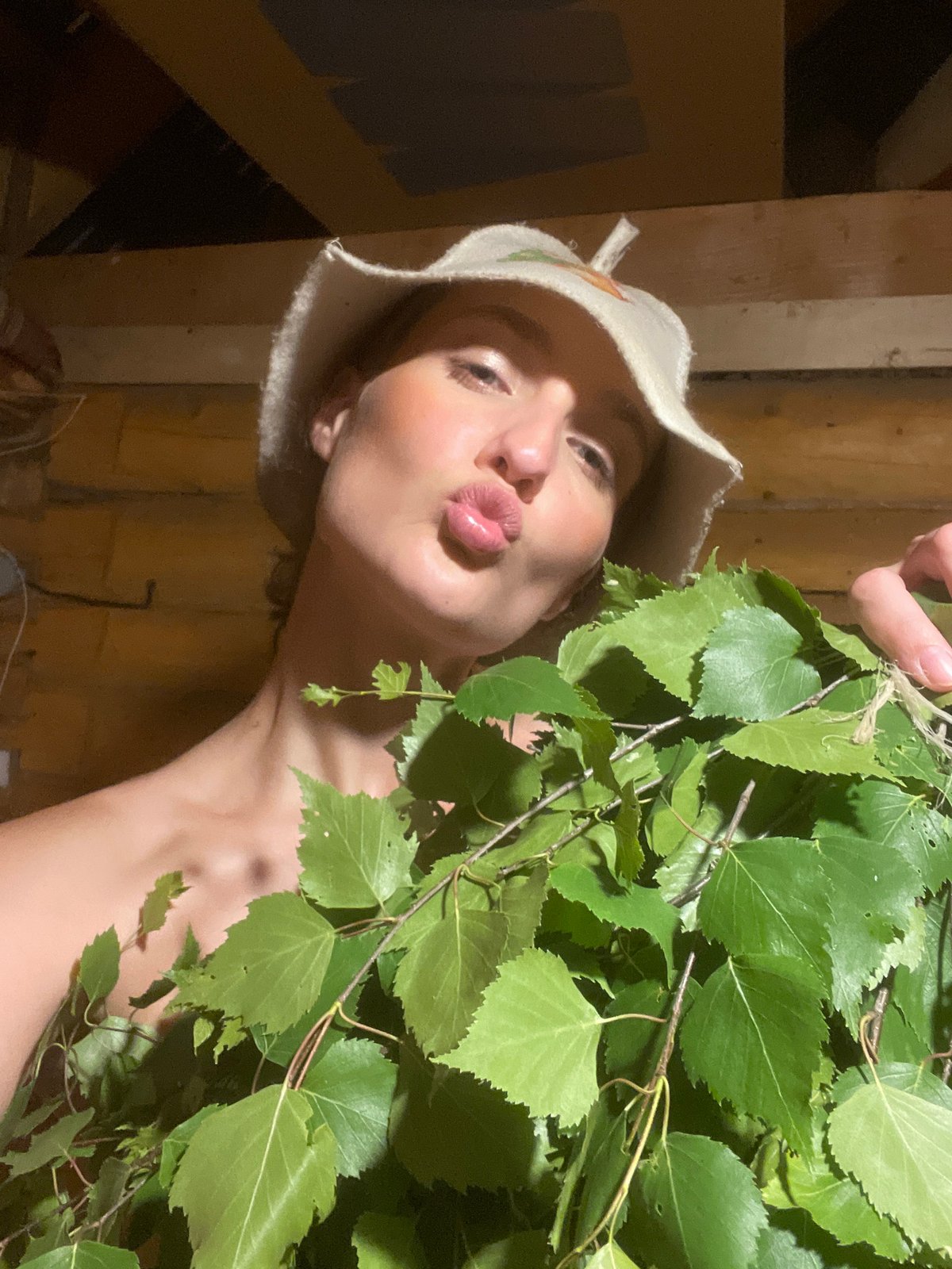 Woman enjoys traditional Russian banya experience in Sharkan sauna