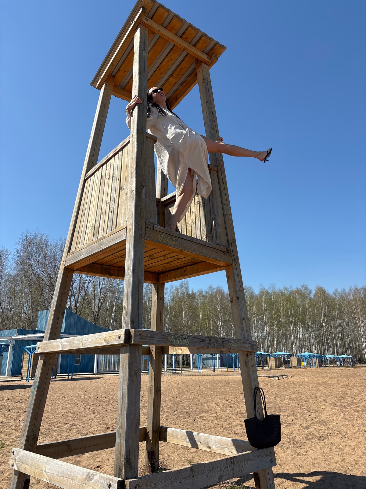 Woman performs acrobatics on playground equipment in Chaikovsky