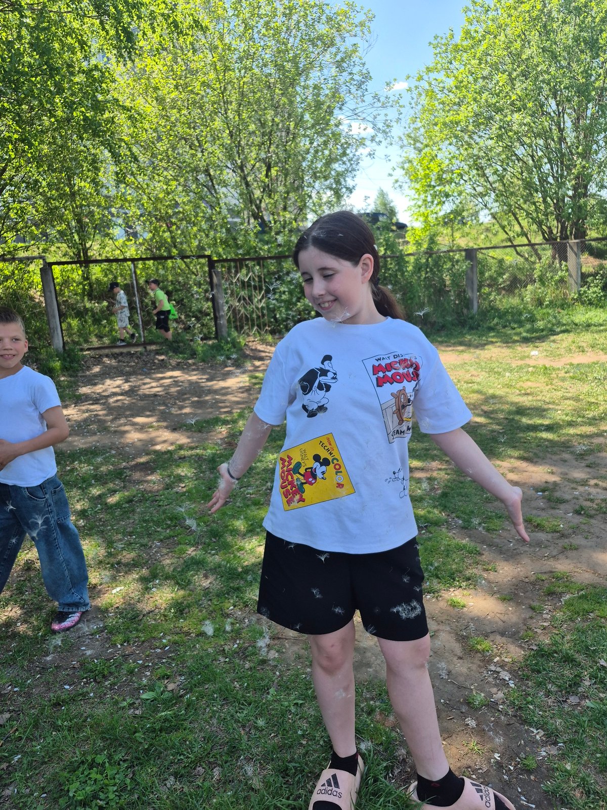 Children play outdoors in spring morning in Chaikovsky, Russia