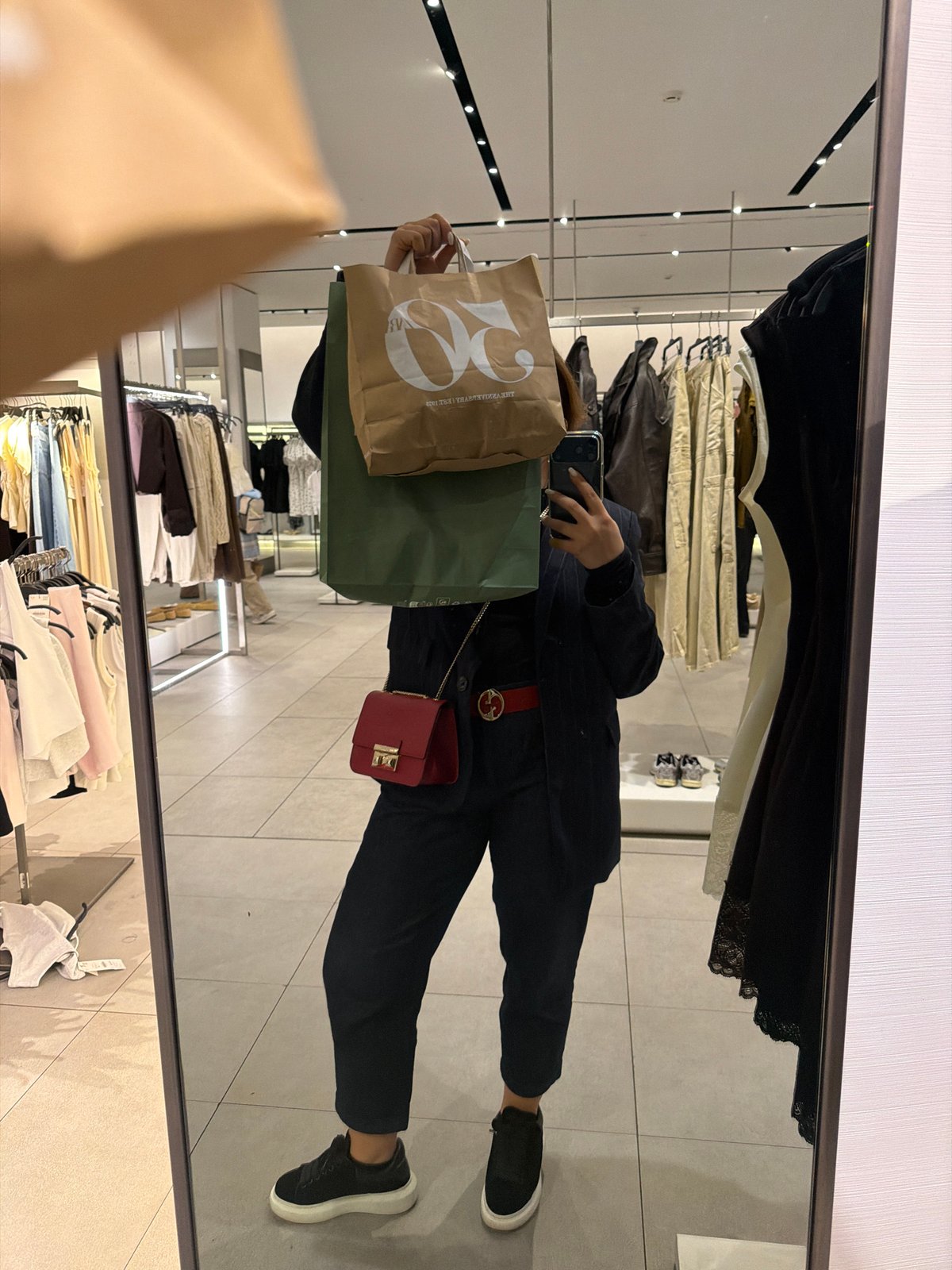 Shopper takes selfies near jewelry stores in Yerevan mall