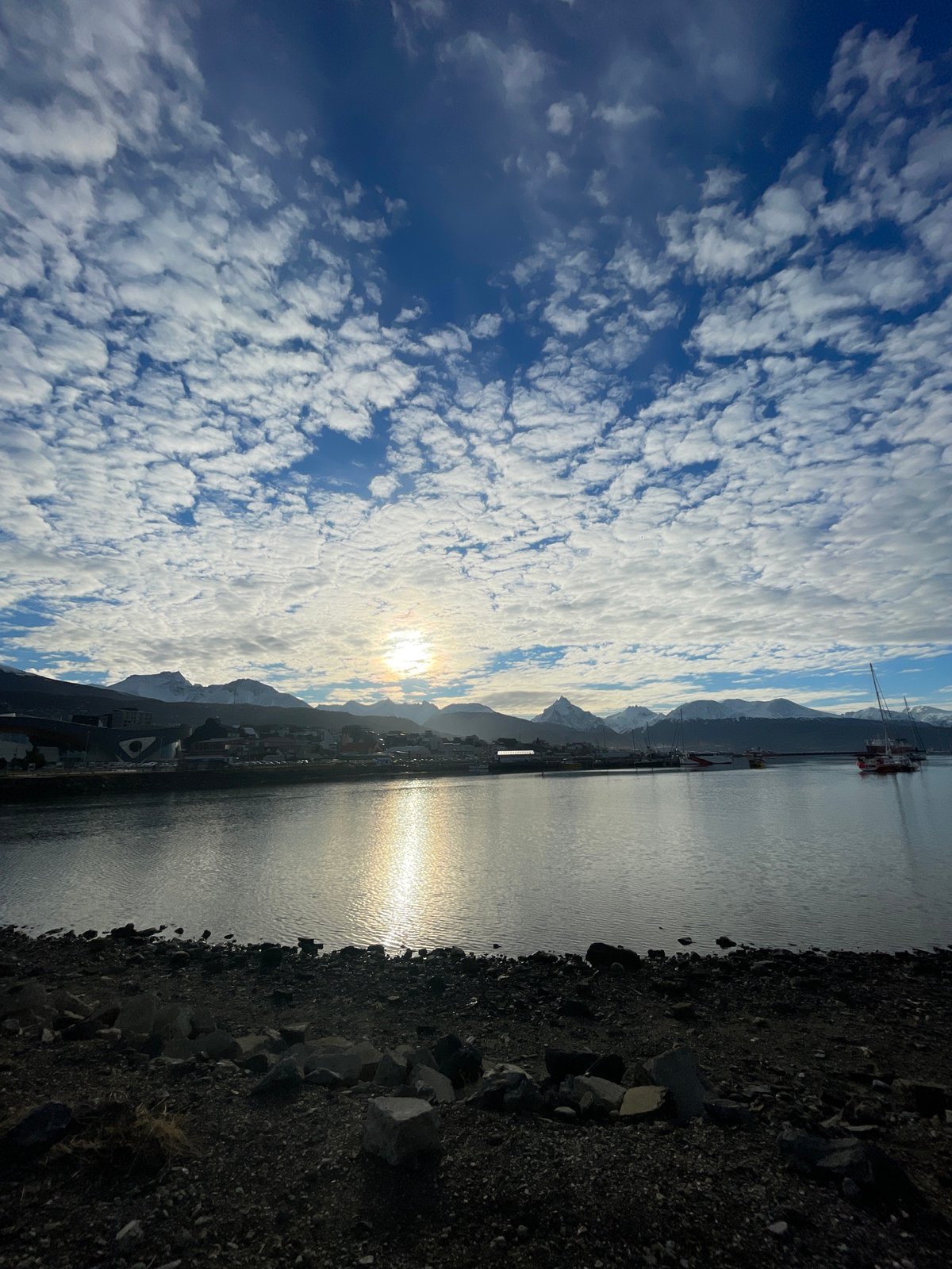 Tourist captures Ushuaia harbor and street scenes on cloudy afternoon