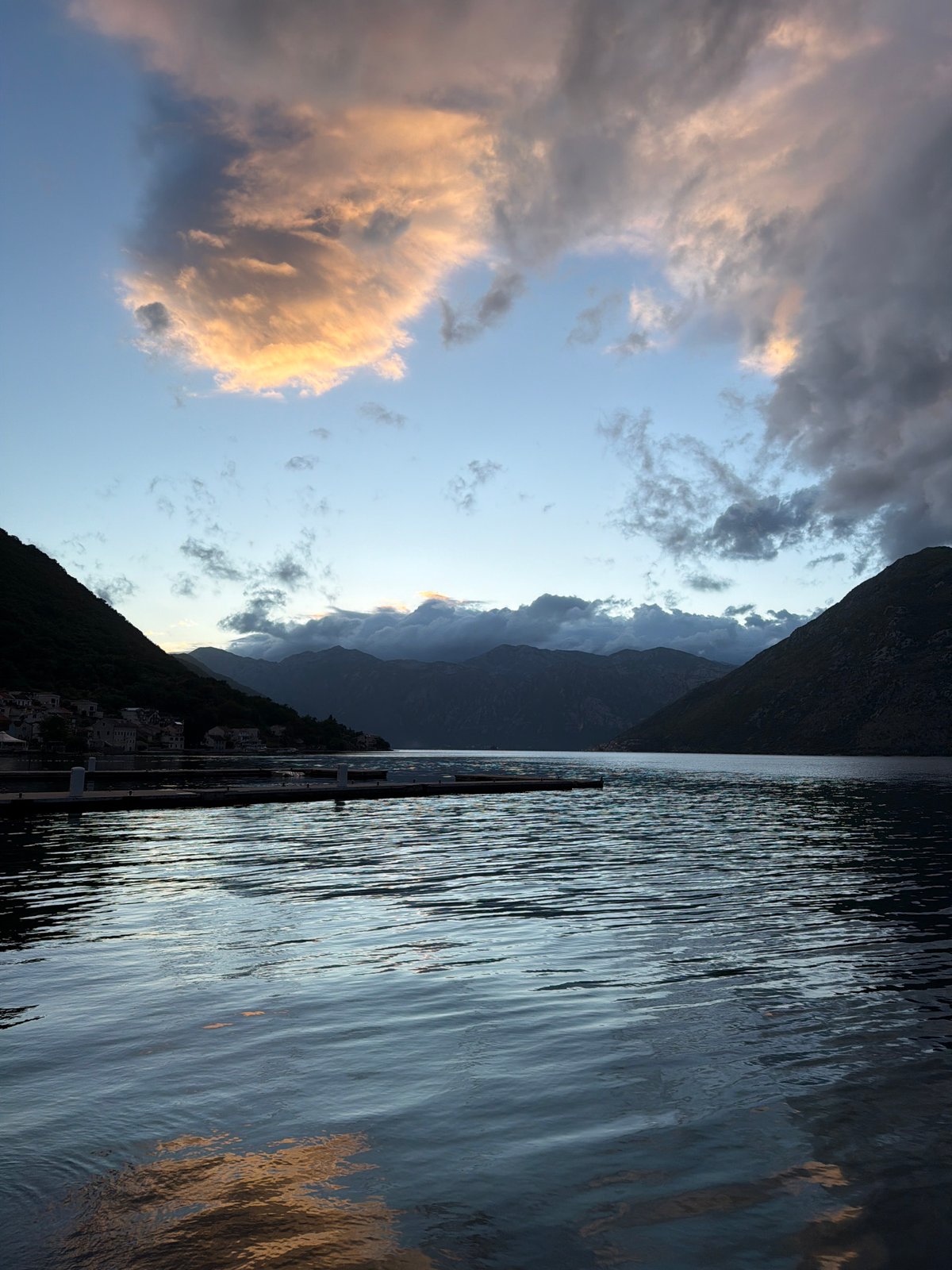 Twilight waterfront moments captured along Prčanj Montenegro's palm-lined bay promenade