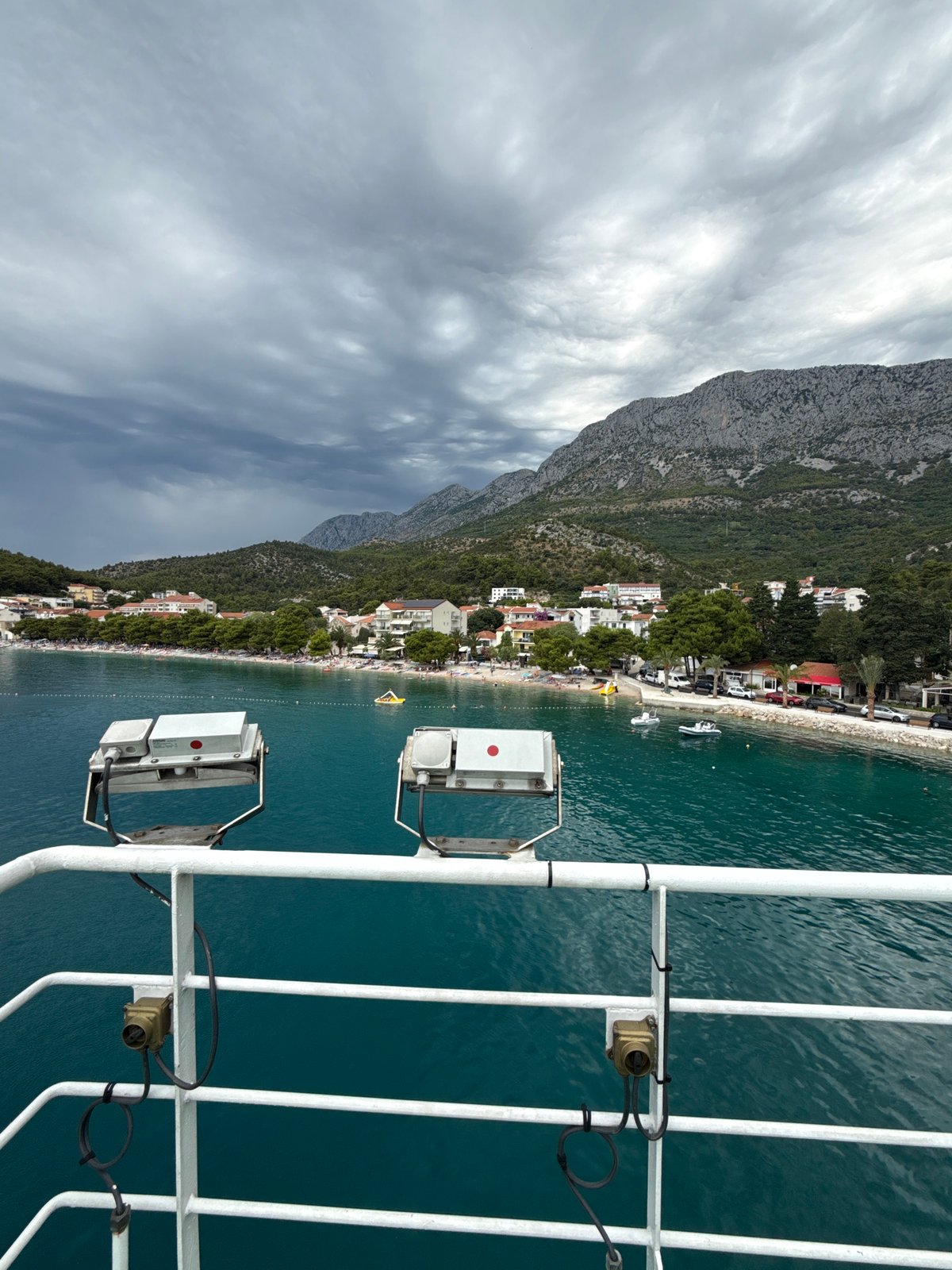 Ferry crossing and harbor scenes at Drvenik on a moody July morning