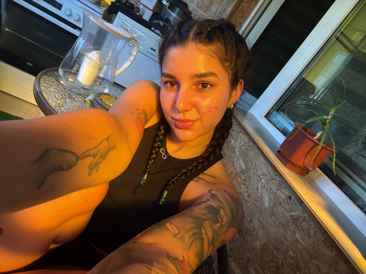 Tattooed woman takes selfies in Veliko Tarnovo, Bulgaria