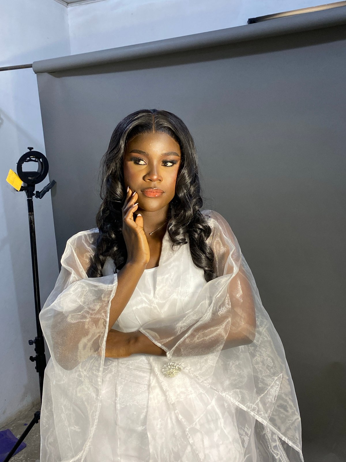 Woman poses for professional photoshoot in Jos studio