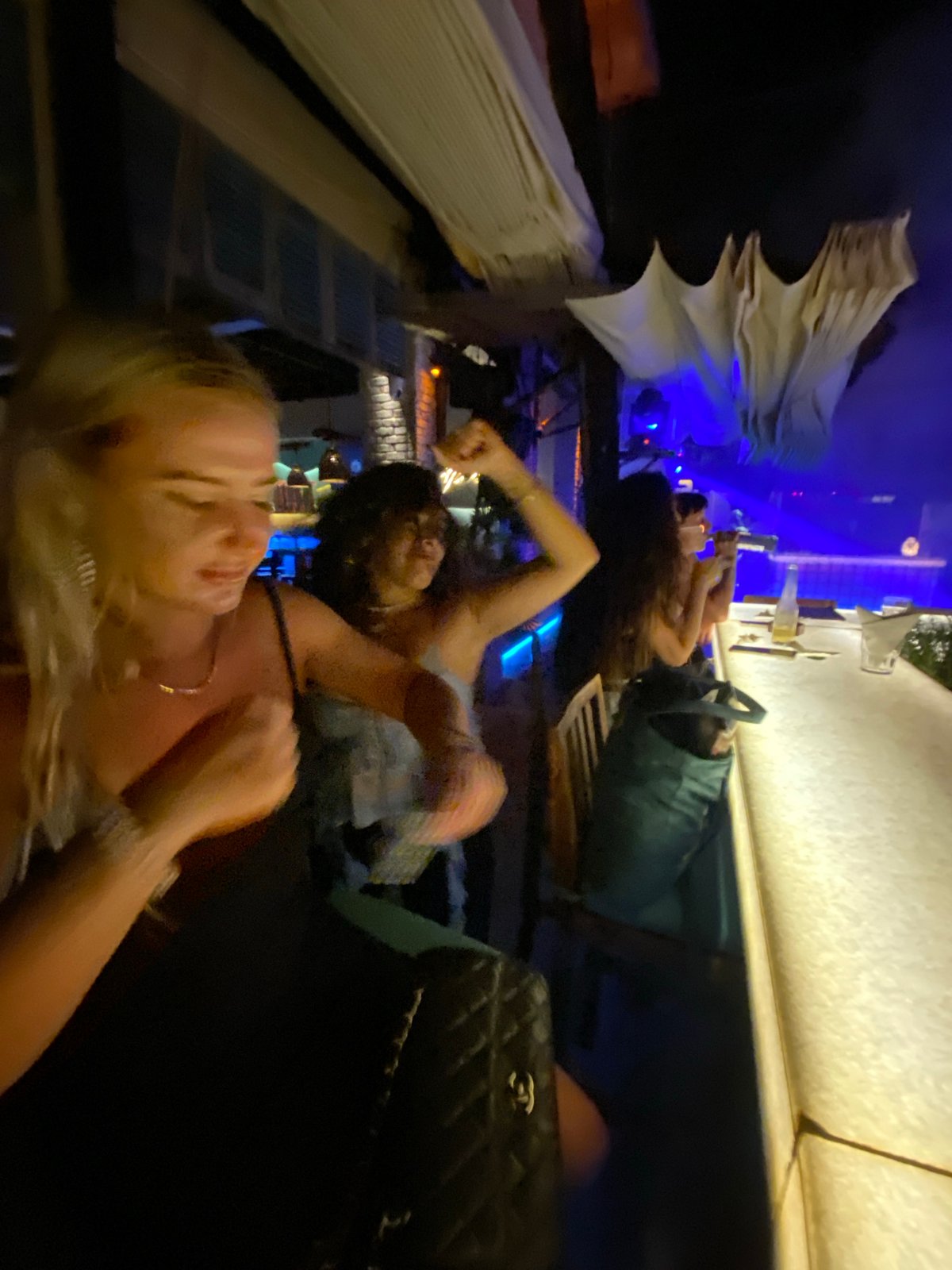 Evening social gathering at tropical-themed nightclub in Vietnam