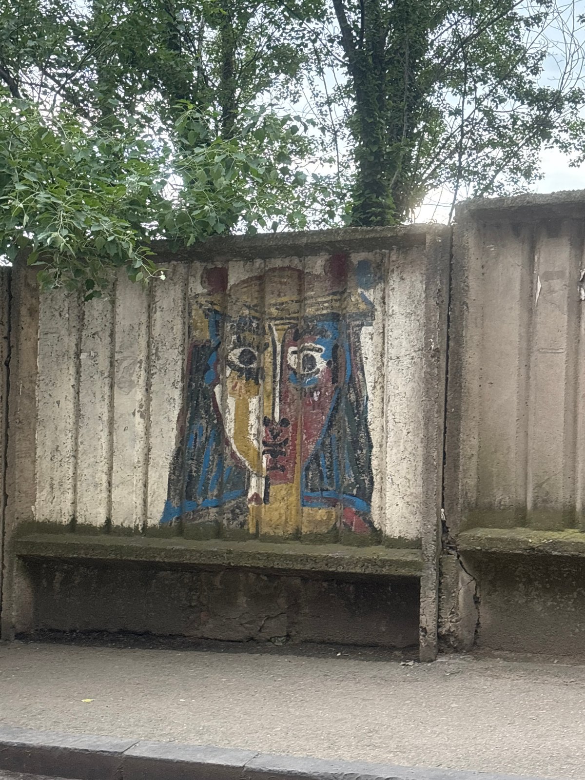 Street scenes captured in Tbilisi featuring murals and taxi