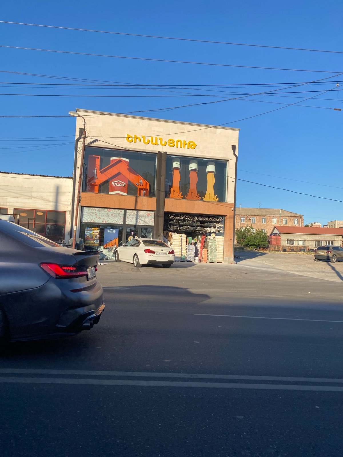 Construction and commerce along a busy Yerevan street