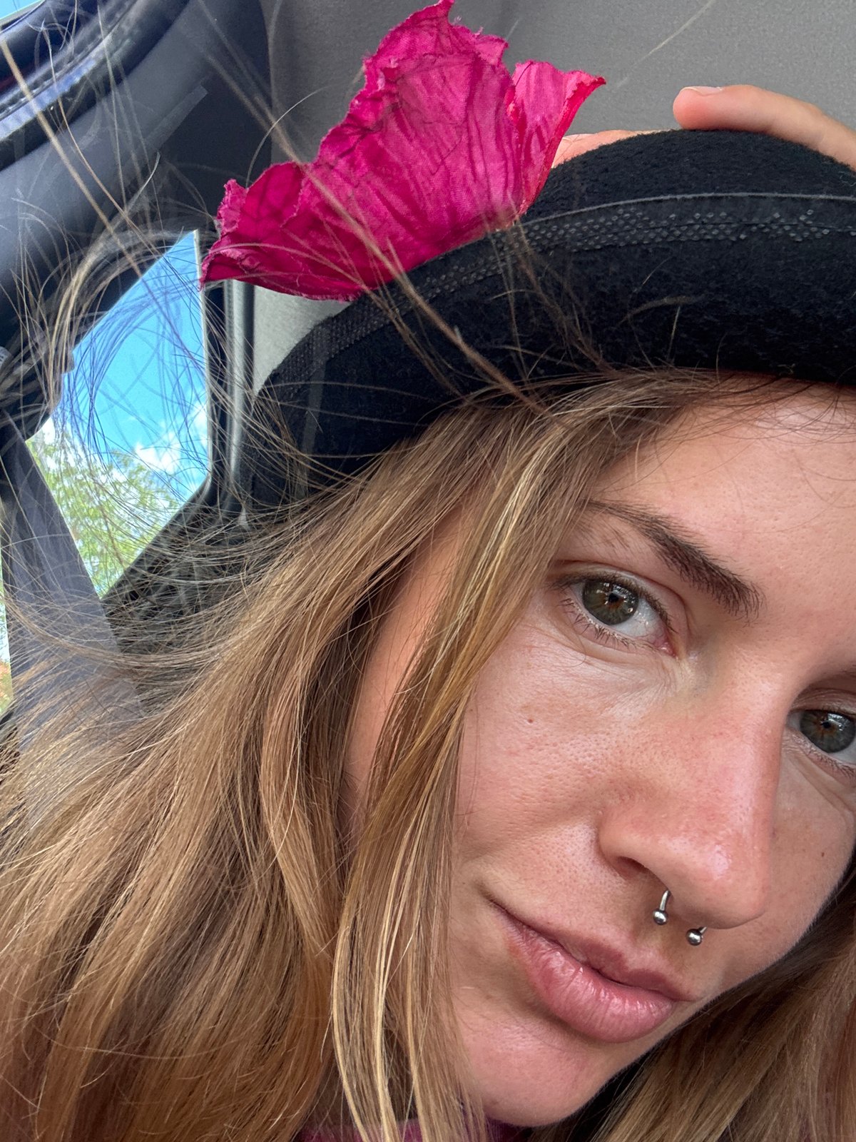 Close-up portrait series featuring a flower-adorned black hat
