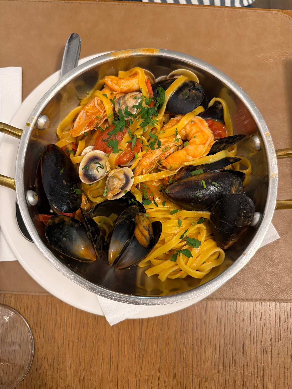 Seafood pasta dinner with wine served in Sofia restaurant