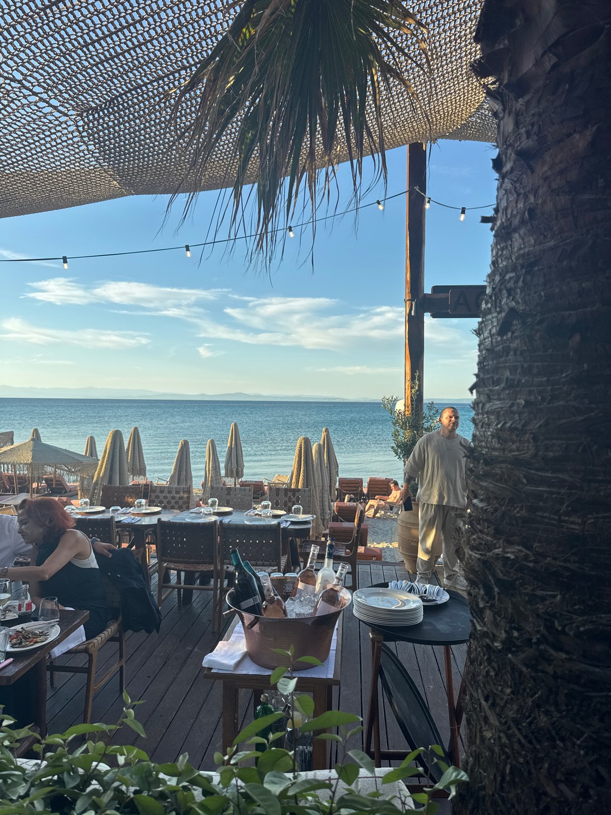 Birthday party celebrated at seaside restaurant in Greece