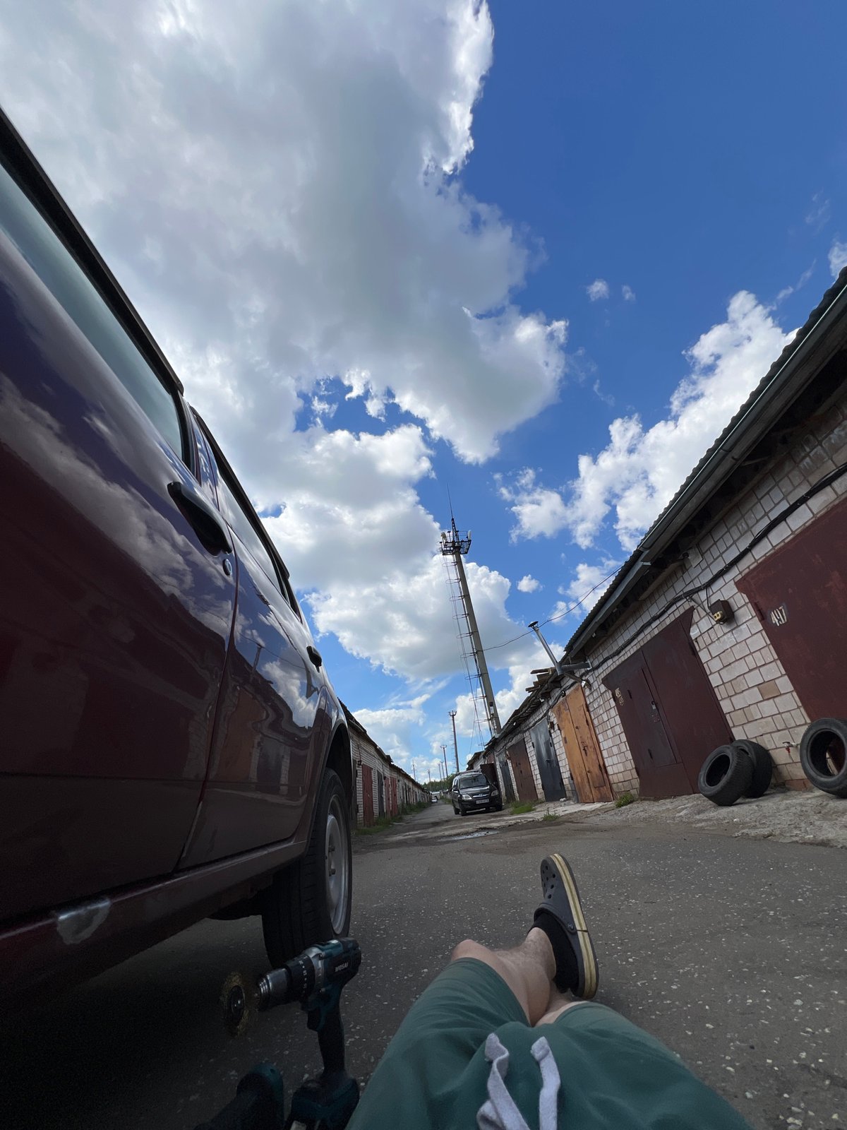Car repair day at a Veteran-2 garage, summer morning