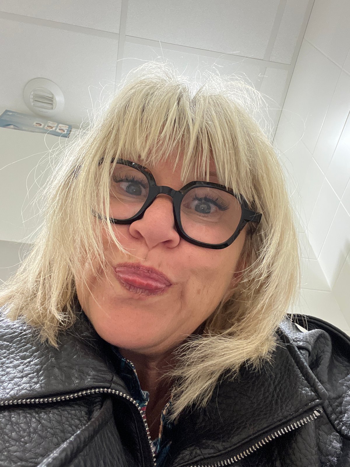 Woman in glasses photographed in La Fouillouse, France