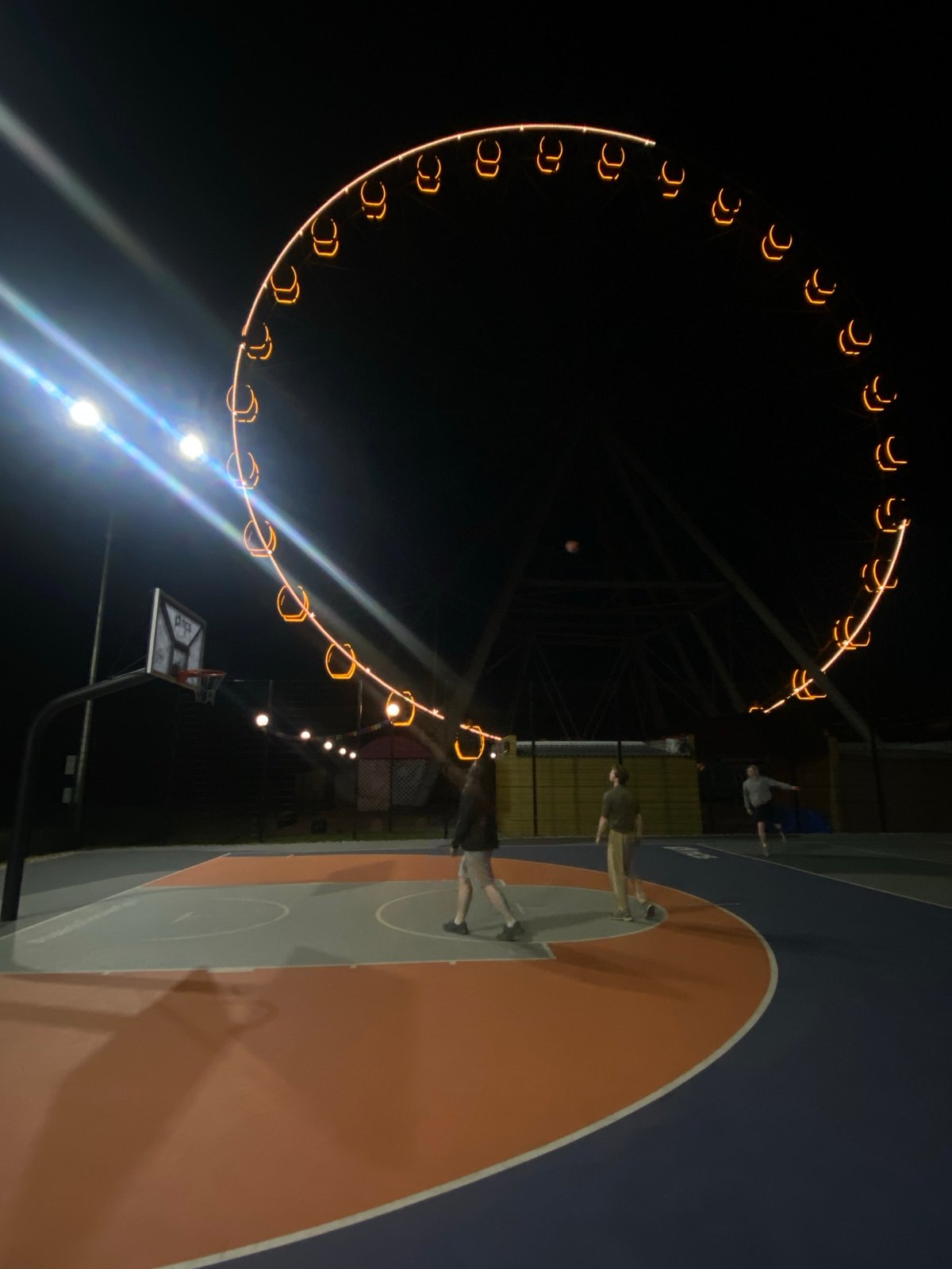 Nighttime basketball court illuminated in Шебунино, Russia