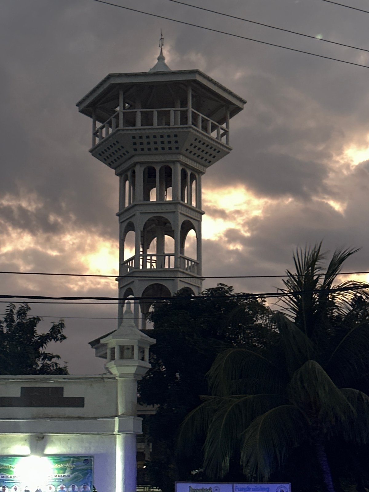 Indonesian minaret and beachside recreation area documented by witness