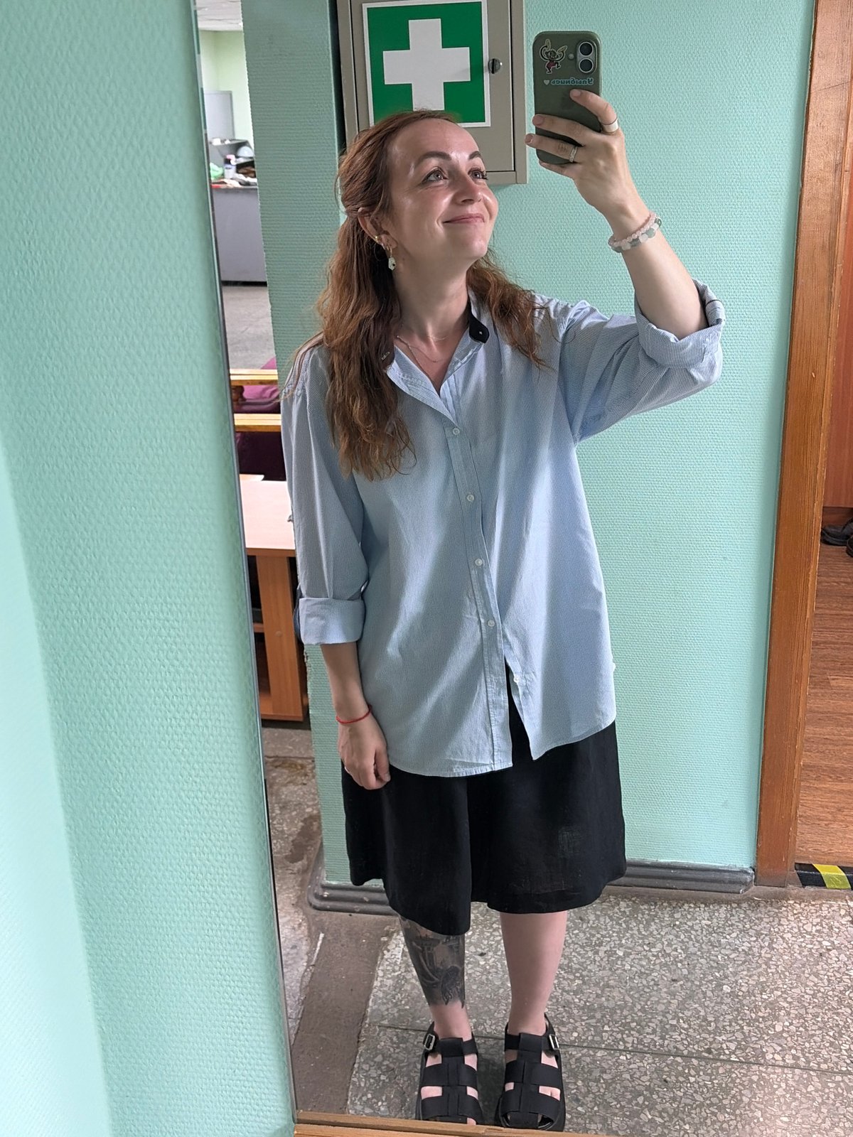 Mirror selfie in an office hallway, Chaikovsky, Russia
