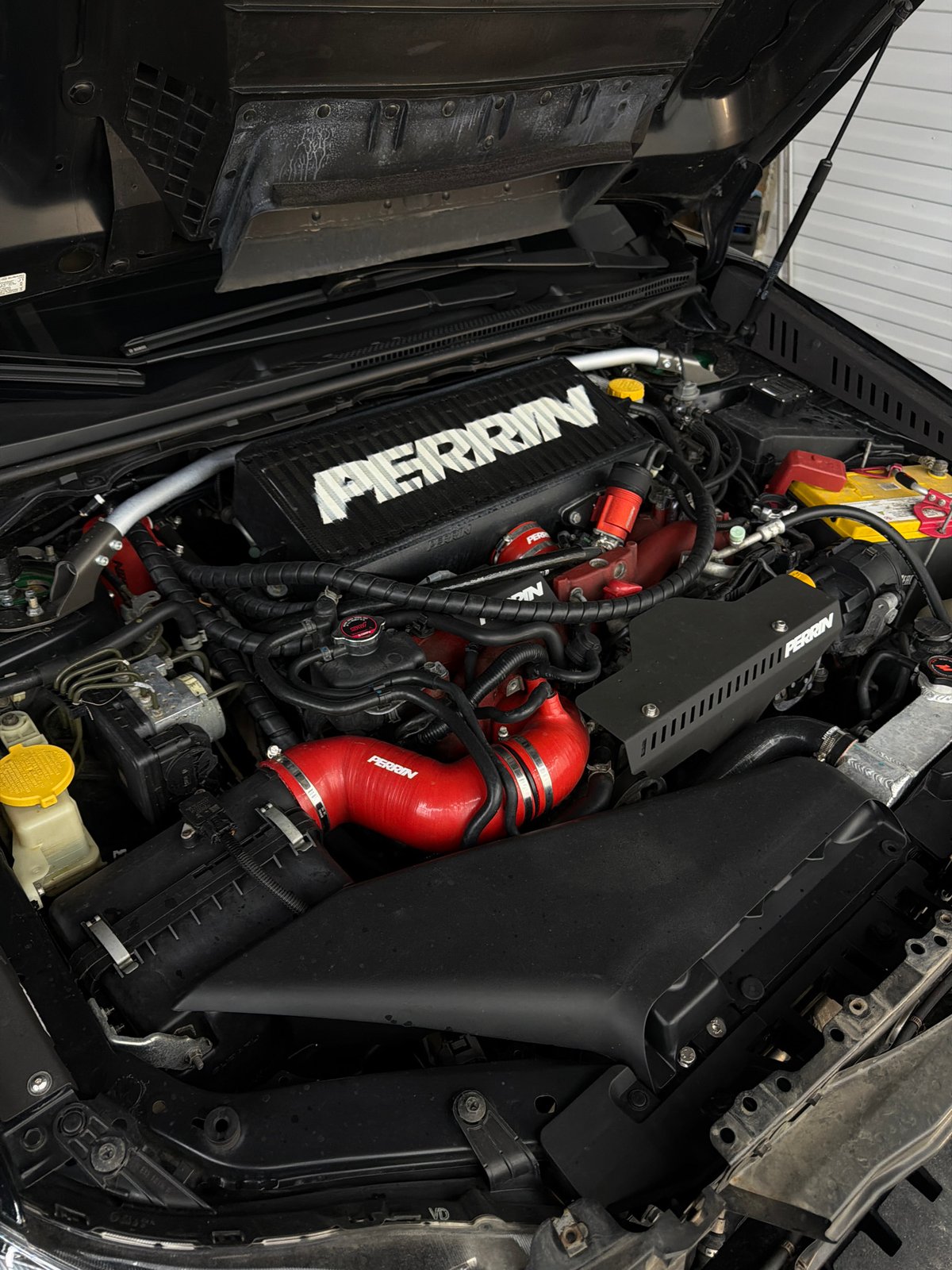 Professional car detailing session documented in Krasnoyarsk automotive facility