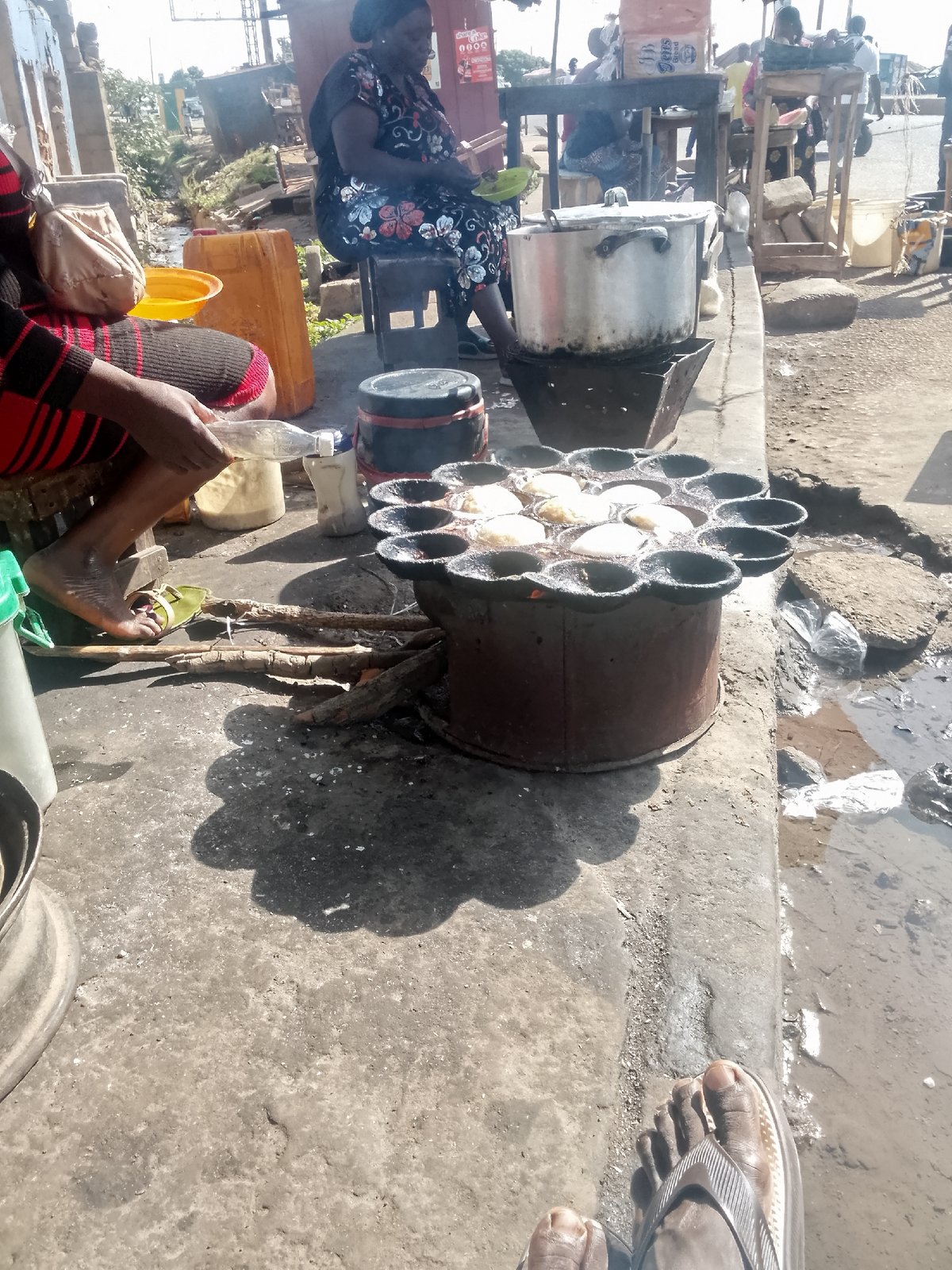 Street food vendors operate morning market scene