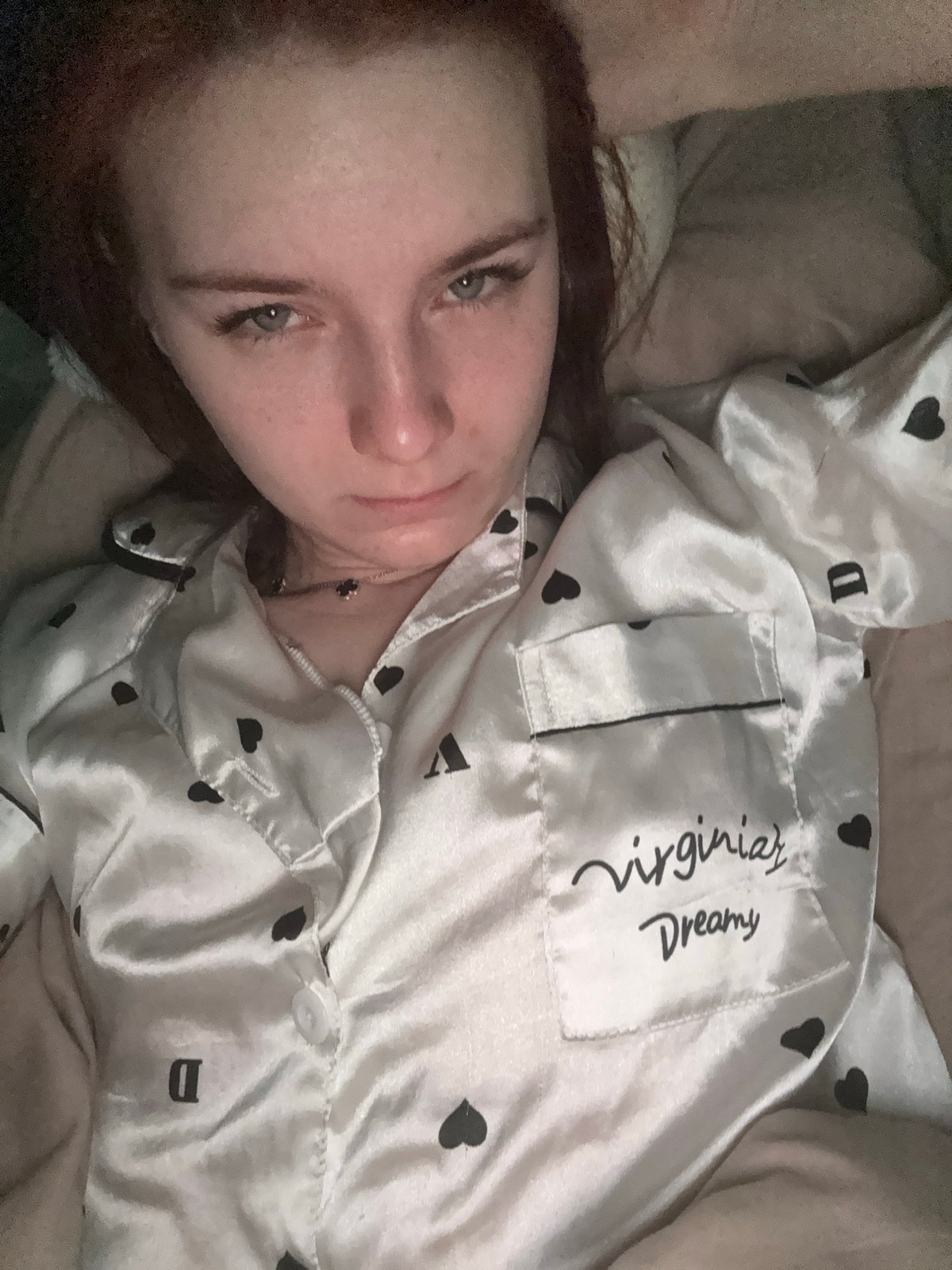 Woman rests in bed during morning hours in Russia