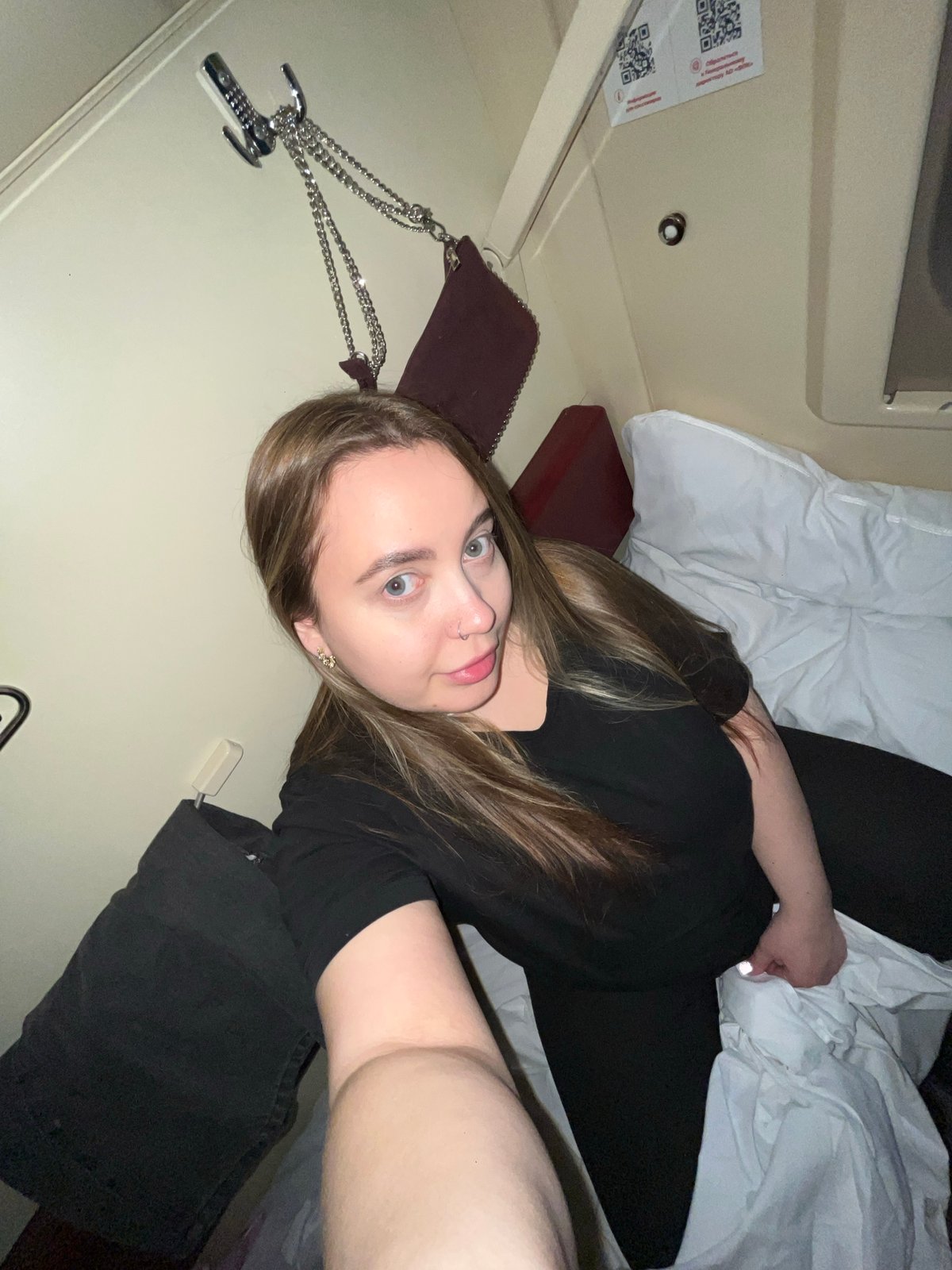 Woman photographs herself in train compartment in Russia