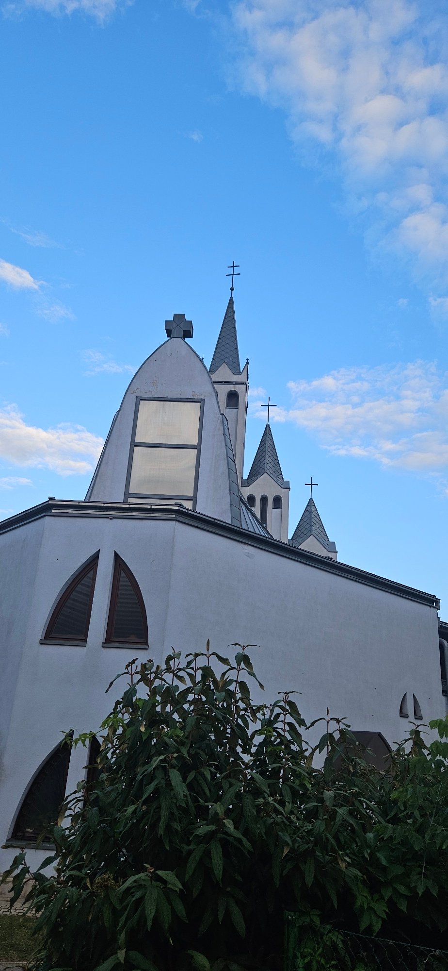 Churches, pine trees, and street details in Hévíz, Hungary