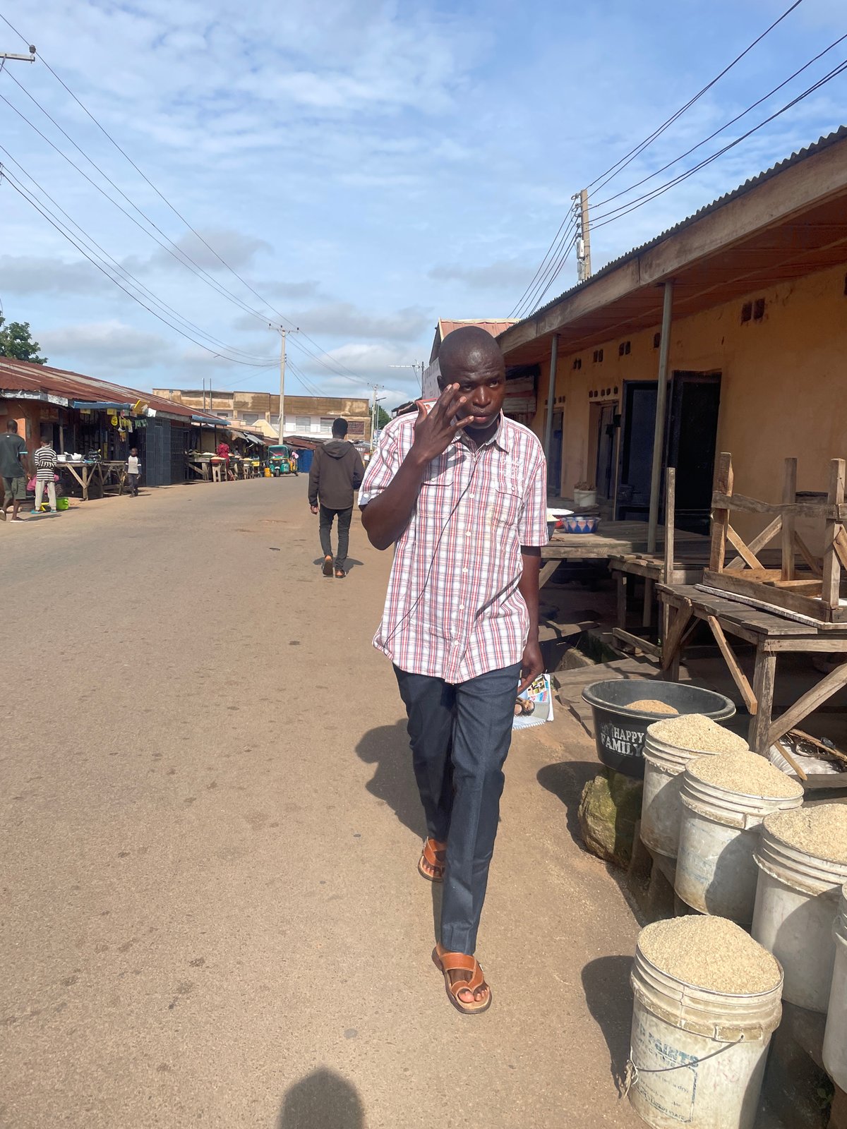 Everyday street scenes near a Jos market, Nigeria.