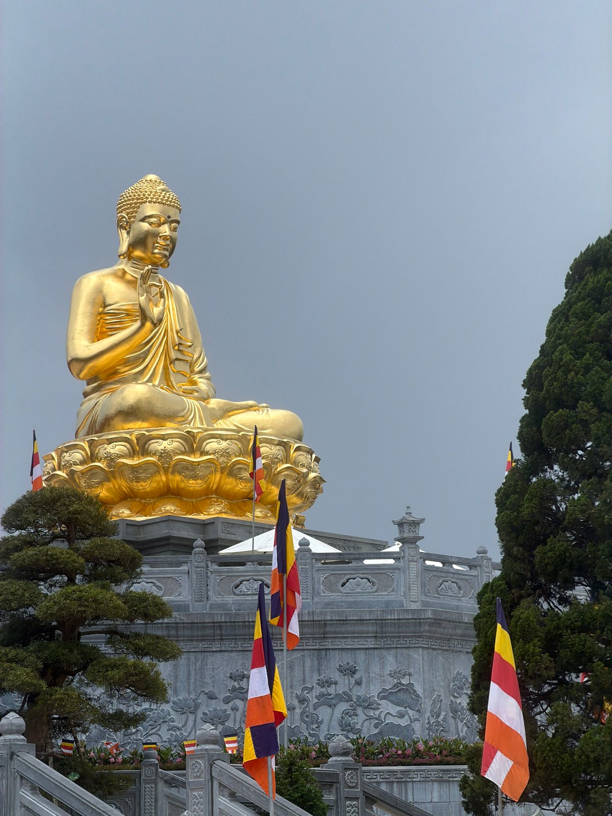 Golden Buddha statue photographed at Suoi Dau temple site