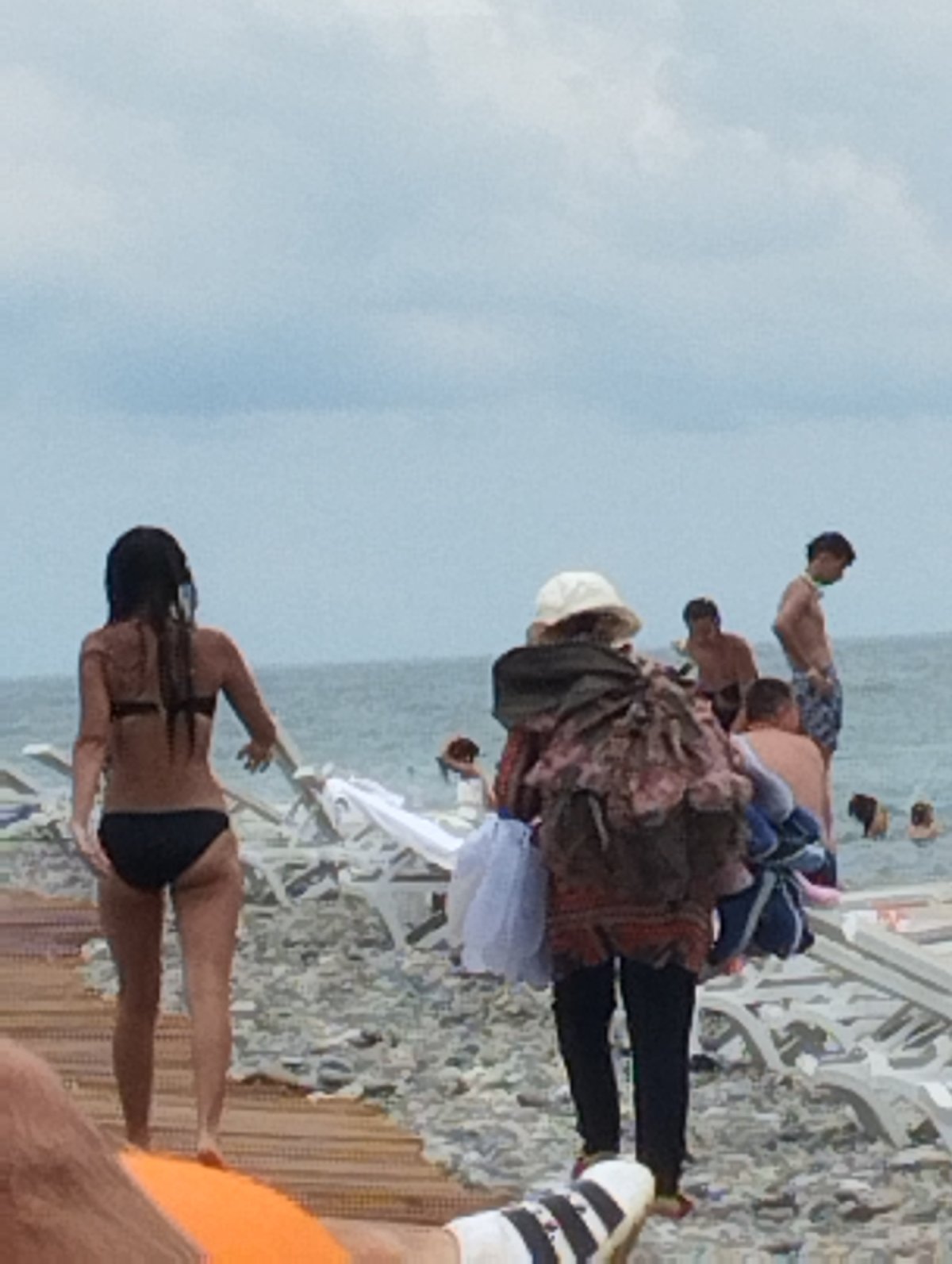 Busy summer morning on Batumi's Black Sea pebble beach