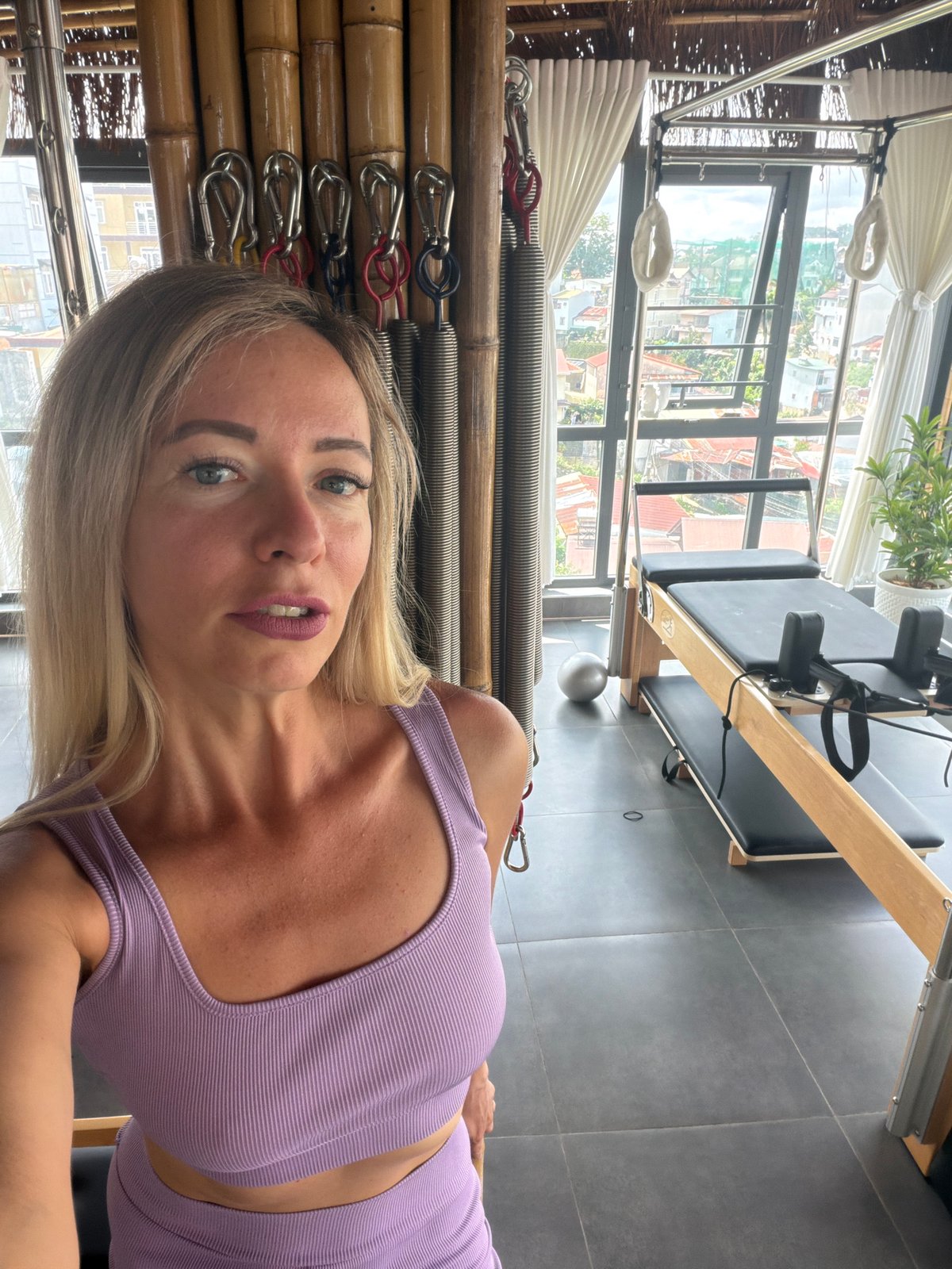 Pilates studio selfies with Da Lat's rooftop skyline as backdrop