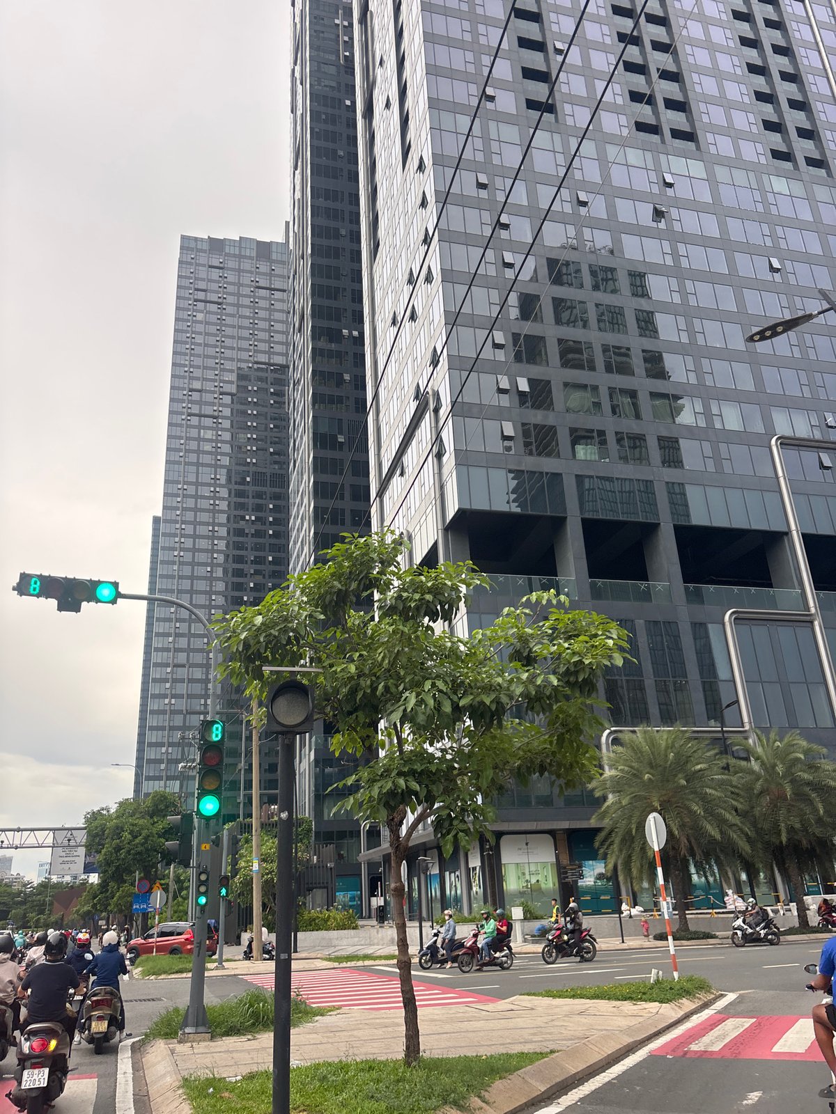 Ho Chi Minh City streets and landmarks on a busy cloudy morning