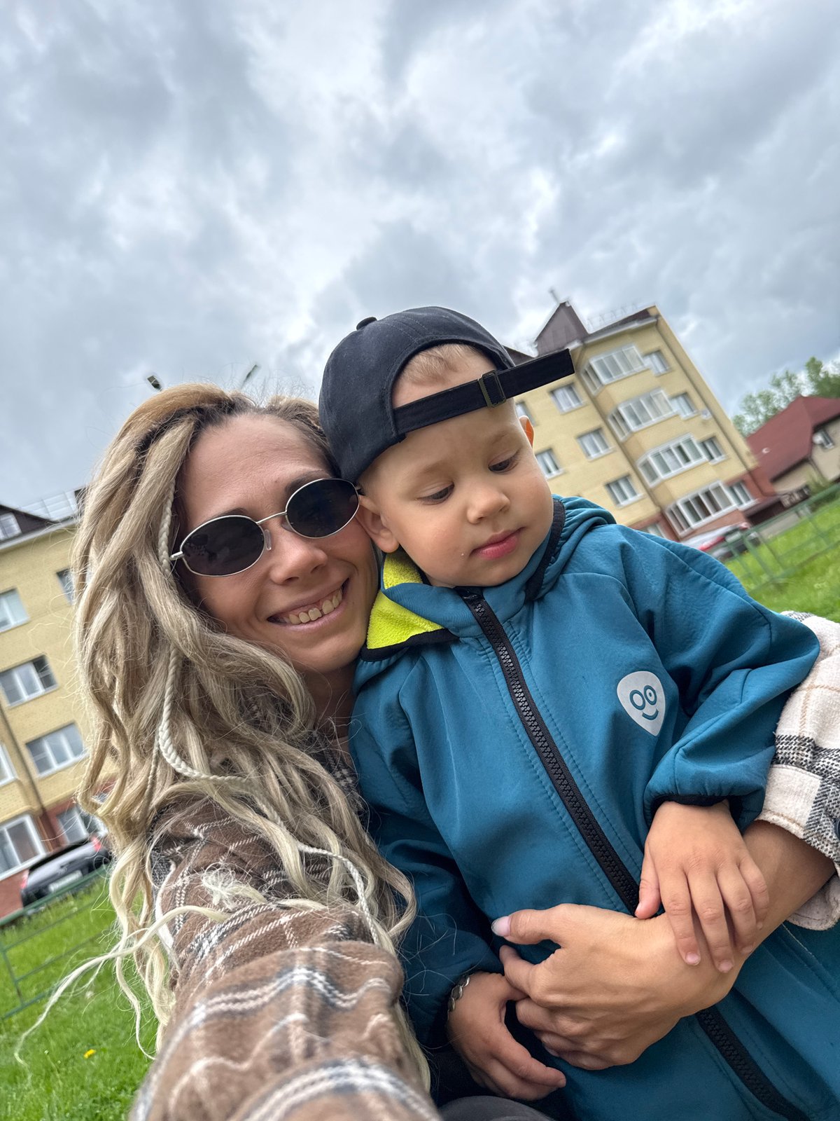 Mother and child enjoy morning playground visit in Rusanovo