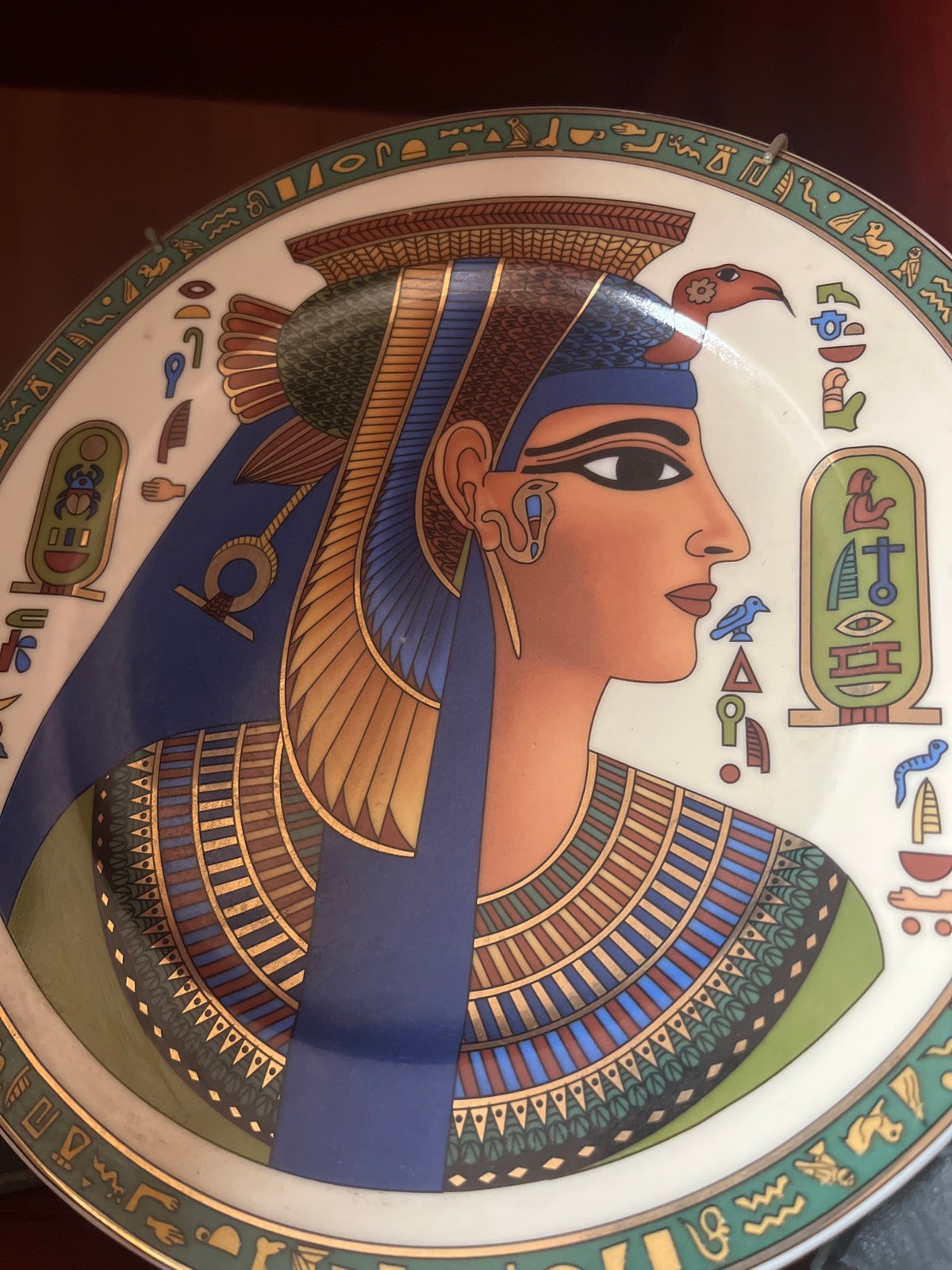 Domestic cat and Egyptian decorative plate photographed in Burgas