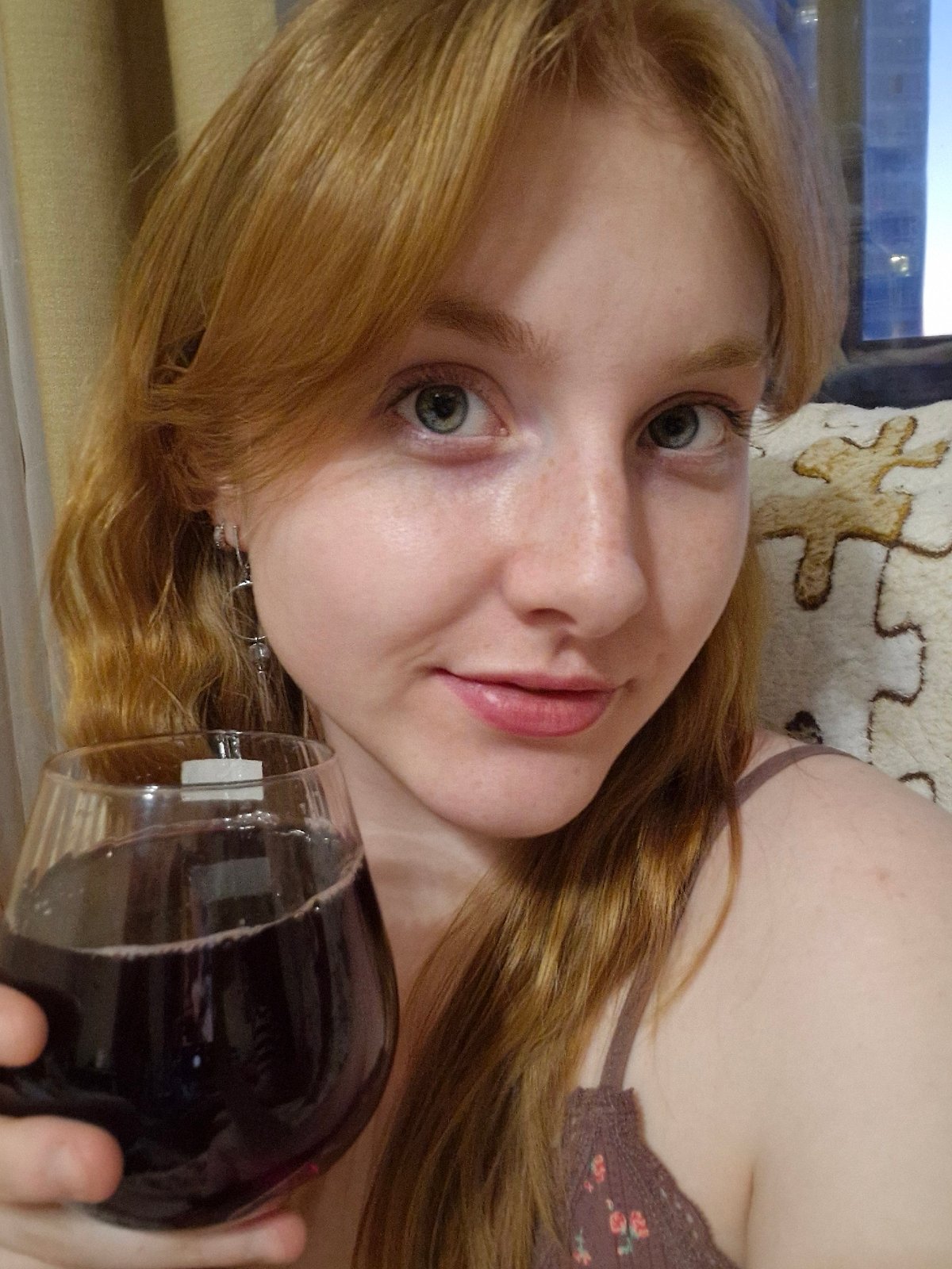 Woman photographed with wine glass in Yekaterinburg apartment